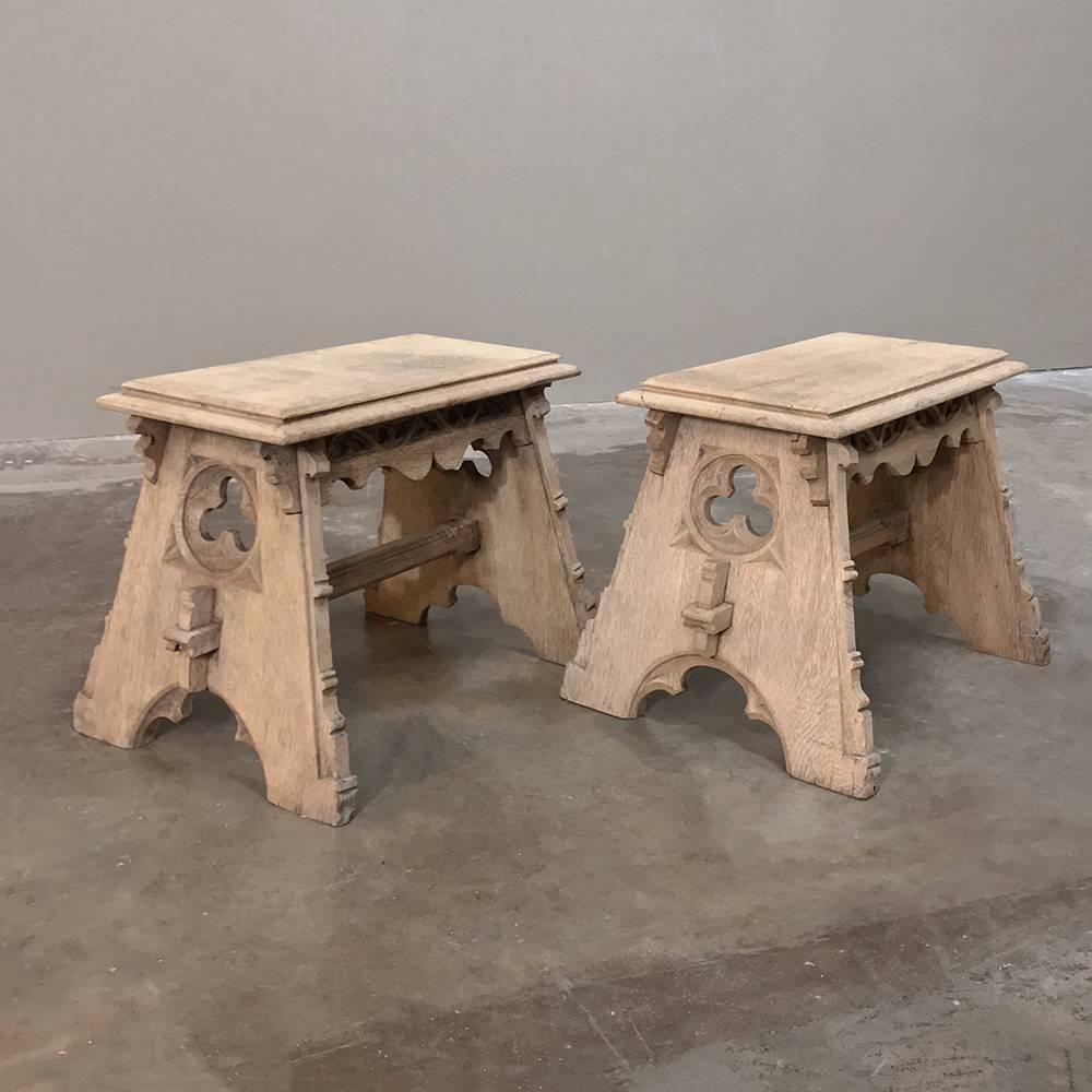 This handsome pair of 19th century French Gothic handcrafted Stripped Oak Footstools were created from solid planks of old-growth quarter-sawn oak to last for centuries! Trapezoidal legs connected with a shimmed stretcher are truly Old School, the