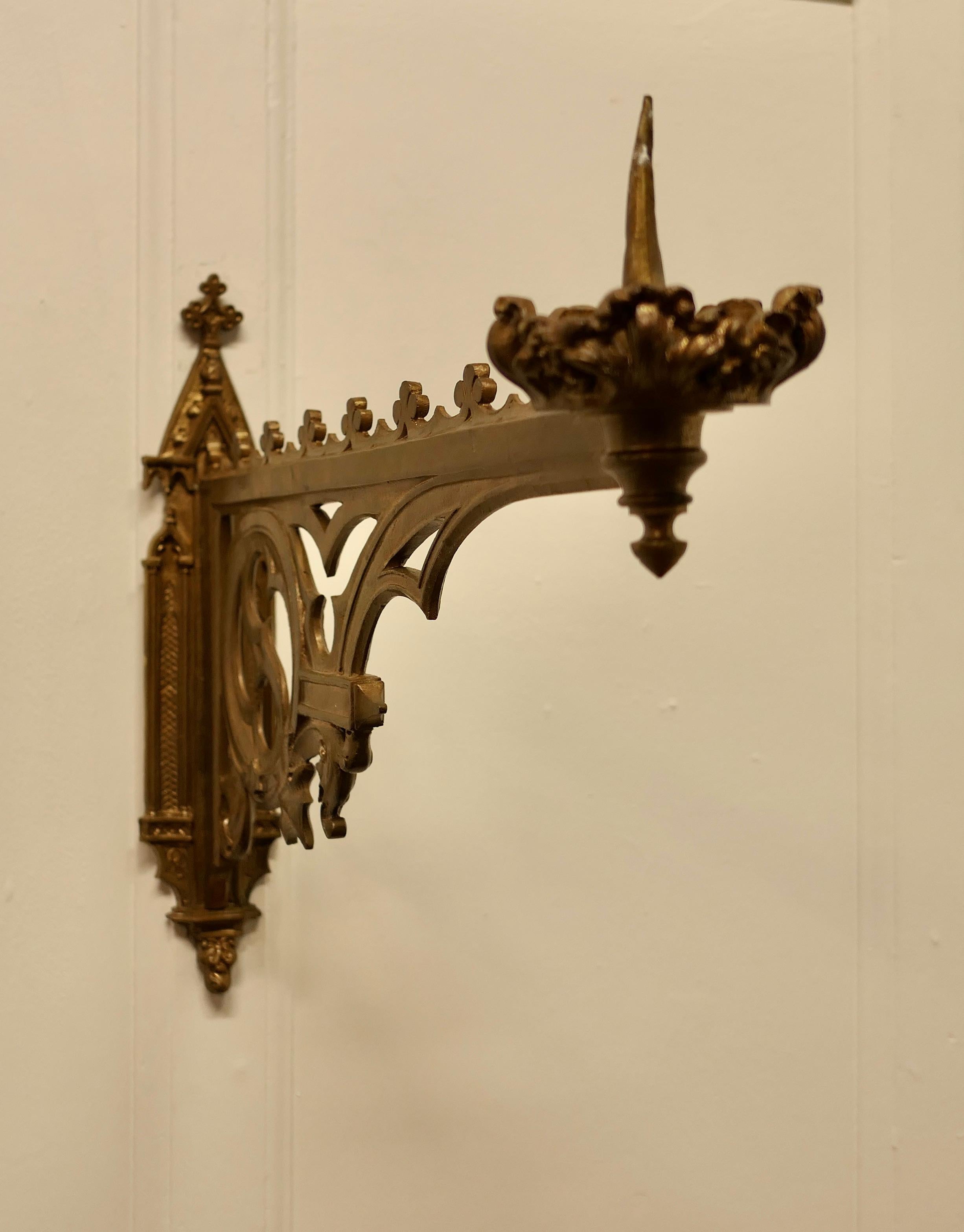 Pair of 19th century French Gothic Wall Sconces

These are a Pair of Large French Arts and Crafts antique wall candle sconces, the brackets have decorative Gothic detail with an arm carrying a large candle sconce which has a decorative drip