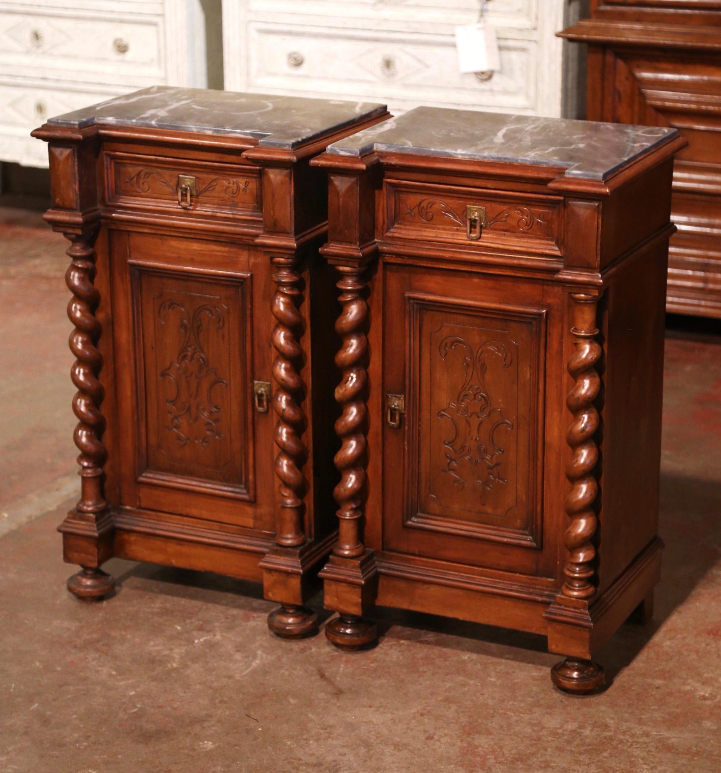 Complete a bedroom with this elegant pair of antique bedside tables. Crafted in France circa 1870 and, each Louis XIII style bedside tables stands on front bun feet over a decorative molded plinth base. Each cabinet features a top carved drawer over