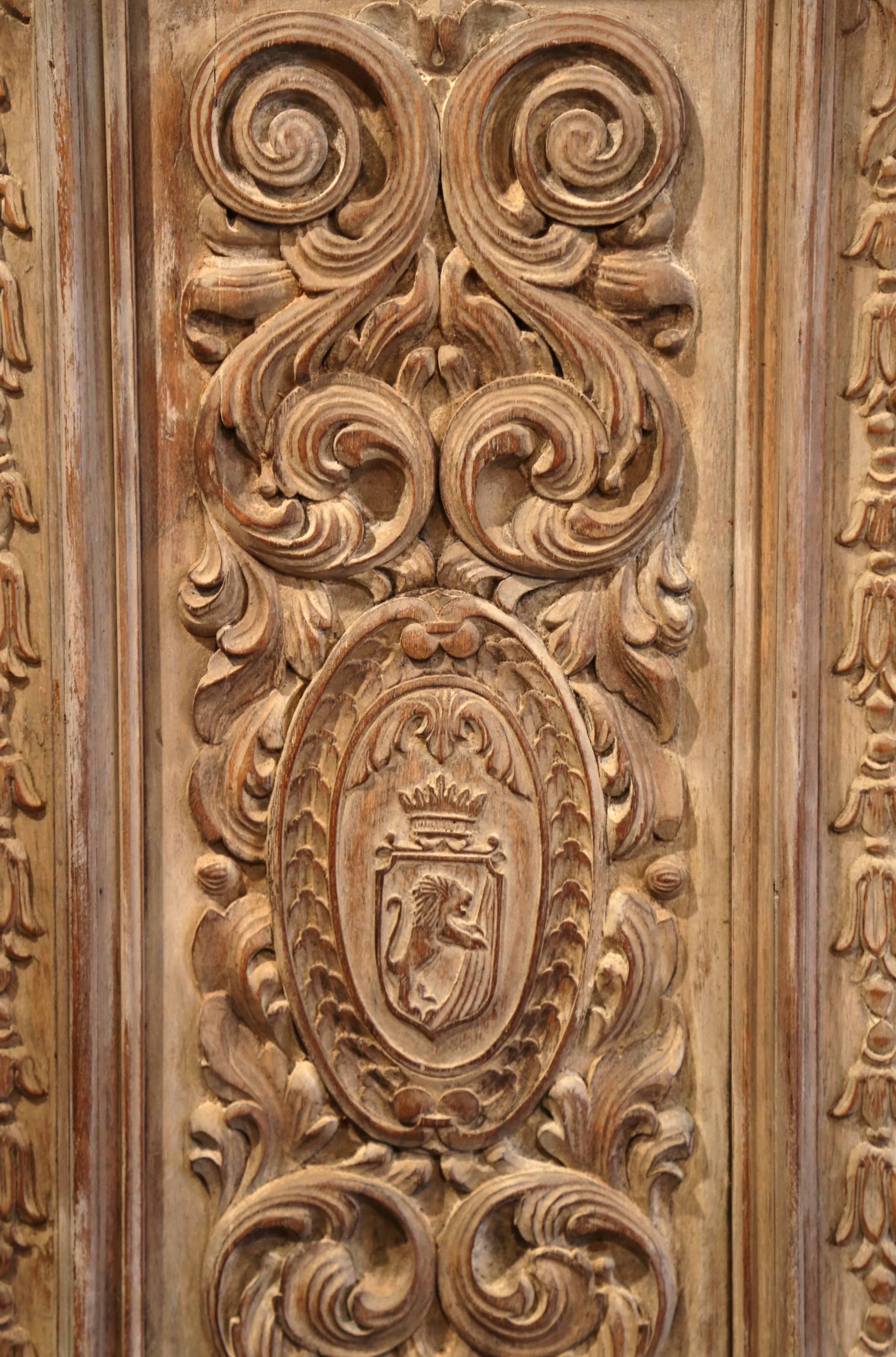 Pair of 19th Century French Hand-Carved Walnut Panel Doors with Family Crests 1