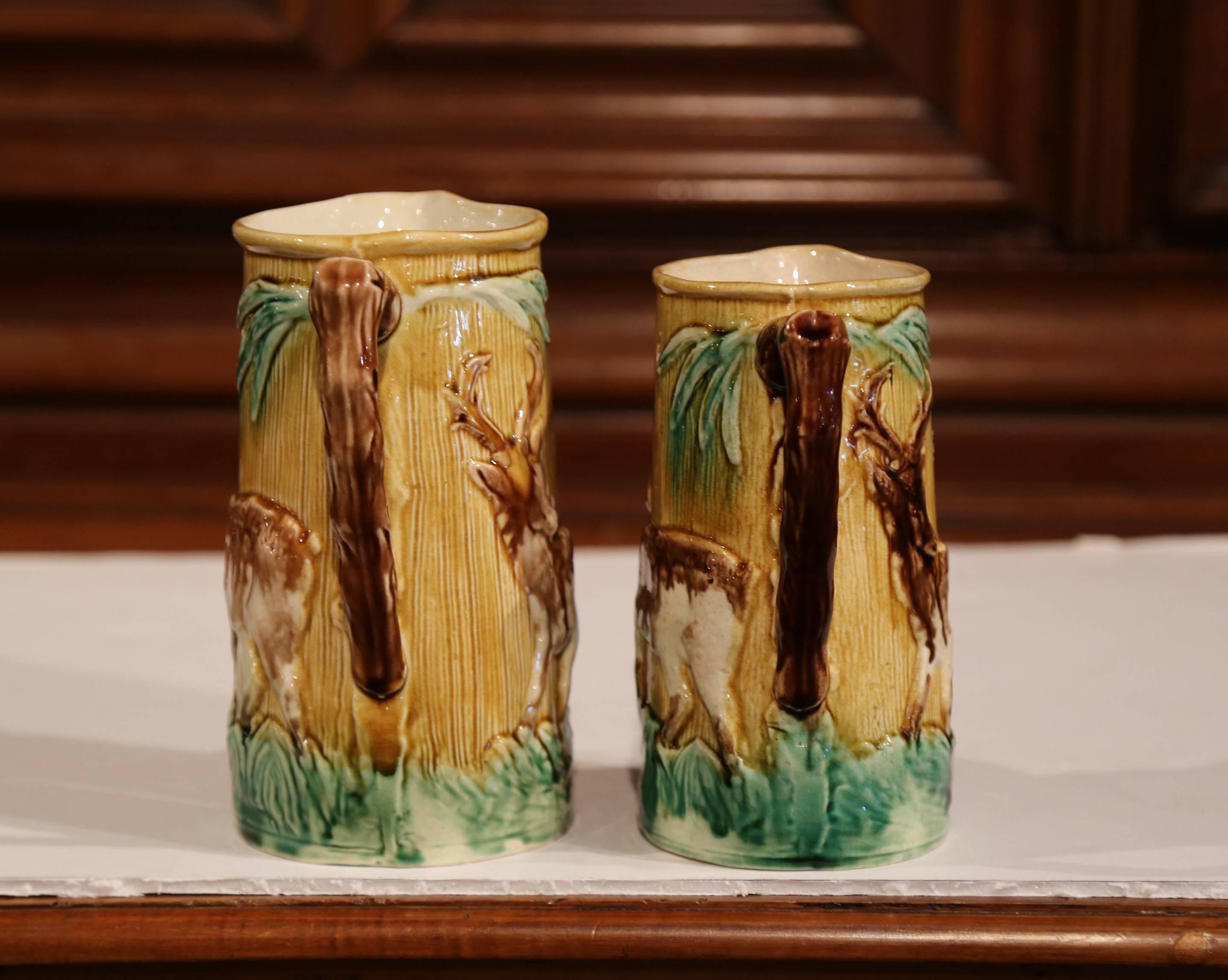 Hand-Crafted Pair of 19th Century French Hand-Painted Barbotine Wine Pitchers with Deer
