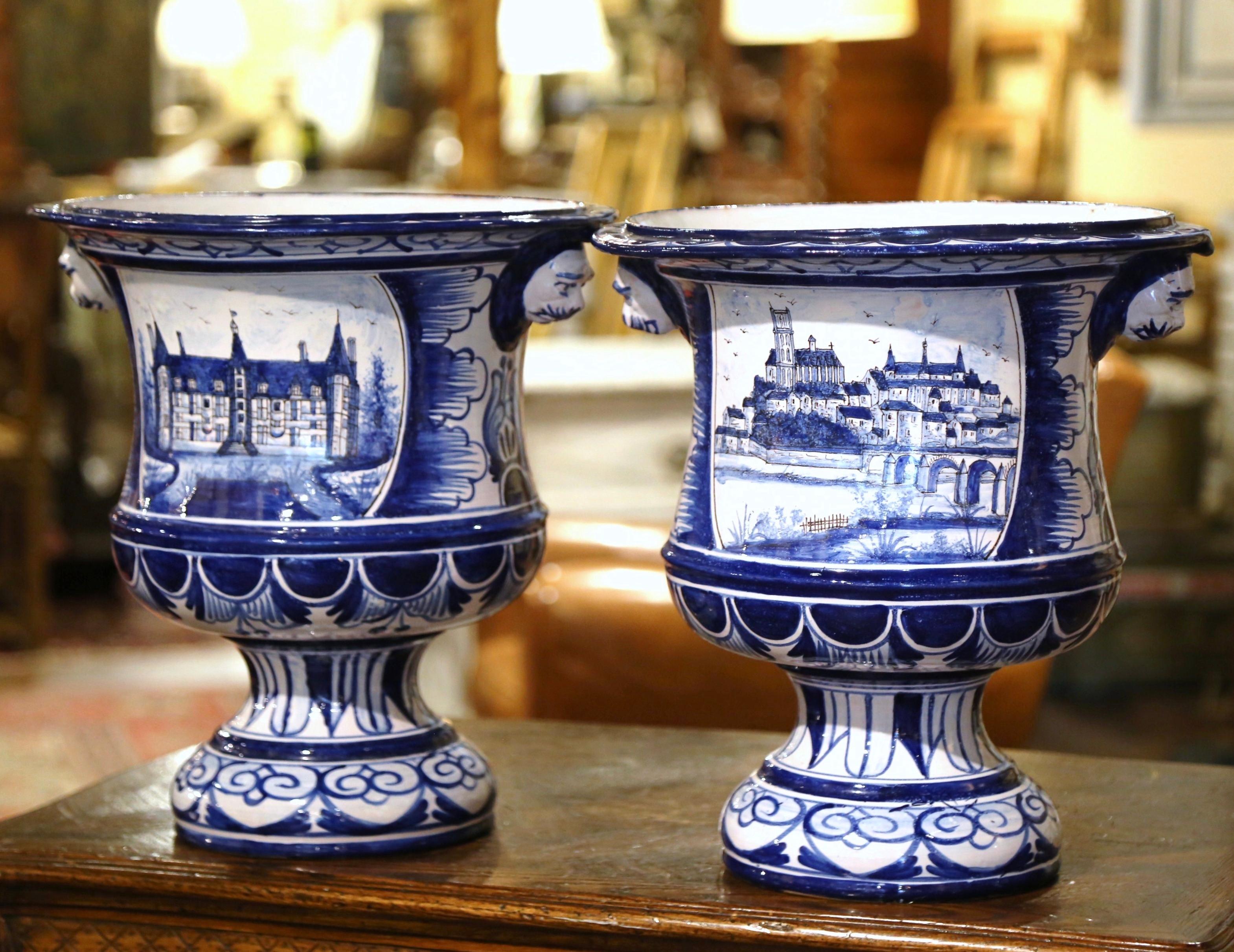 Bring colors to a room with these elegant, antique faience planters. Crafted in Nevers, France, circa 1890, and signed by Montagnon, the large, porcelain cache-pot stand on a circular base, dressed with elegant lion heads handles. Each round pot