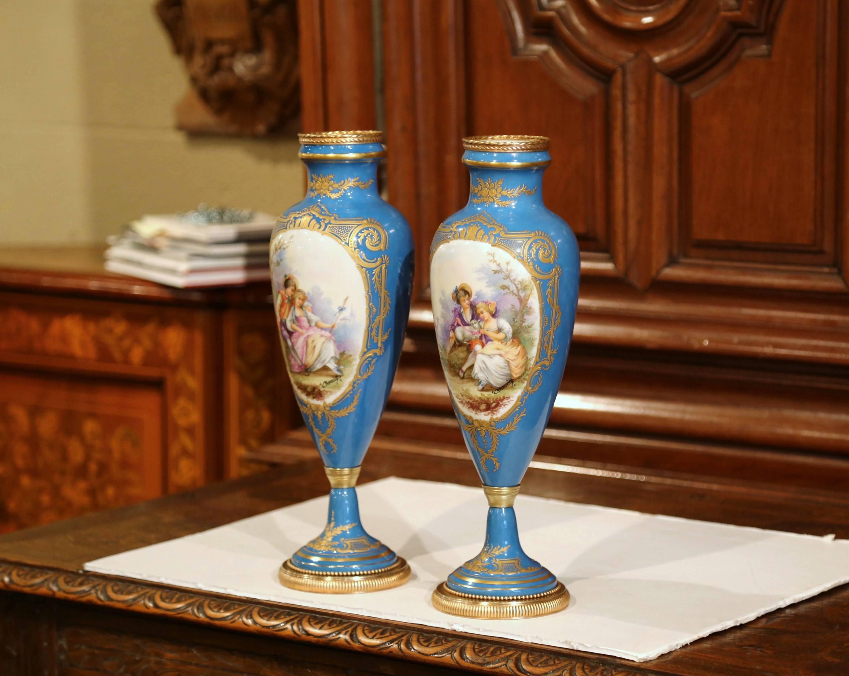Louis XVI Pair of 19th Century French Hand Painted Porcelain and Bronze Blue Sevres Urns