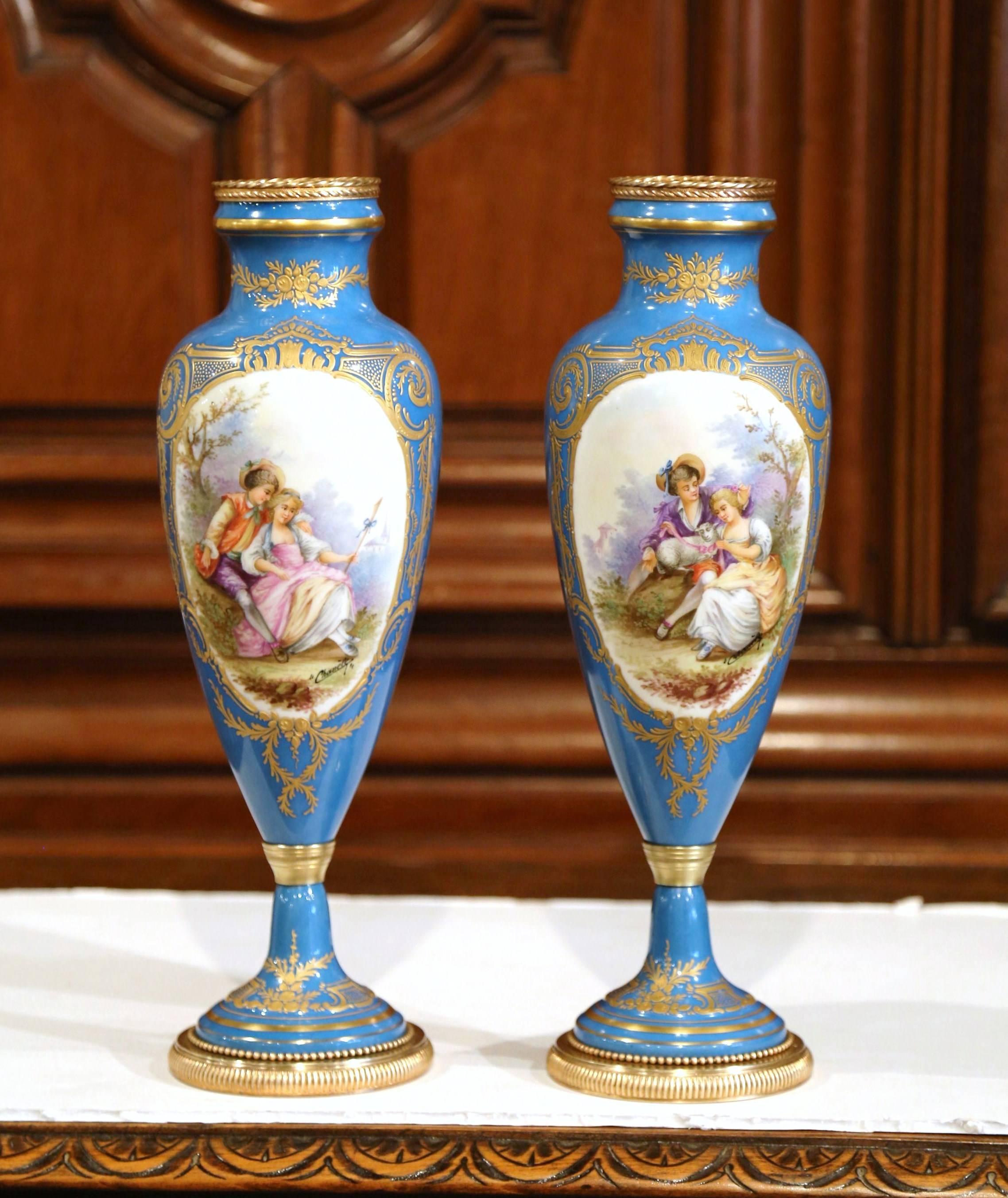 Gilt Pair of 19th Century French Hand Painted Porcelain and Bronze Blue Sevres Urns