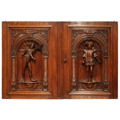 Paire de portes en chêne sculpté Henri II du XIXe siècle avec sculptures en haut-relief