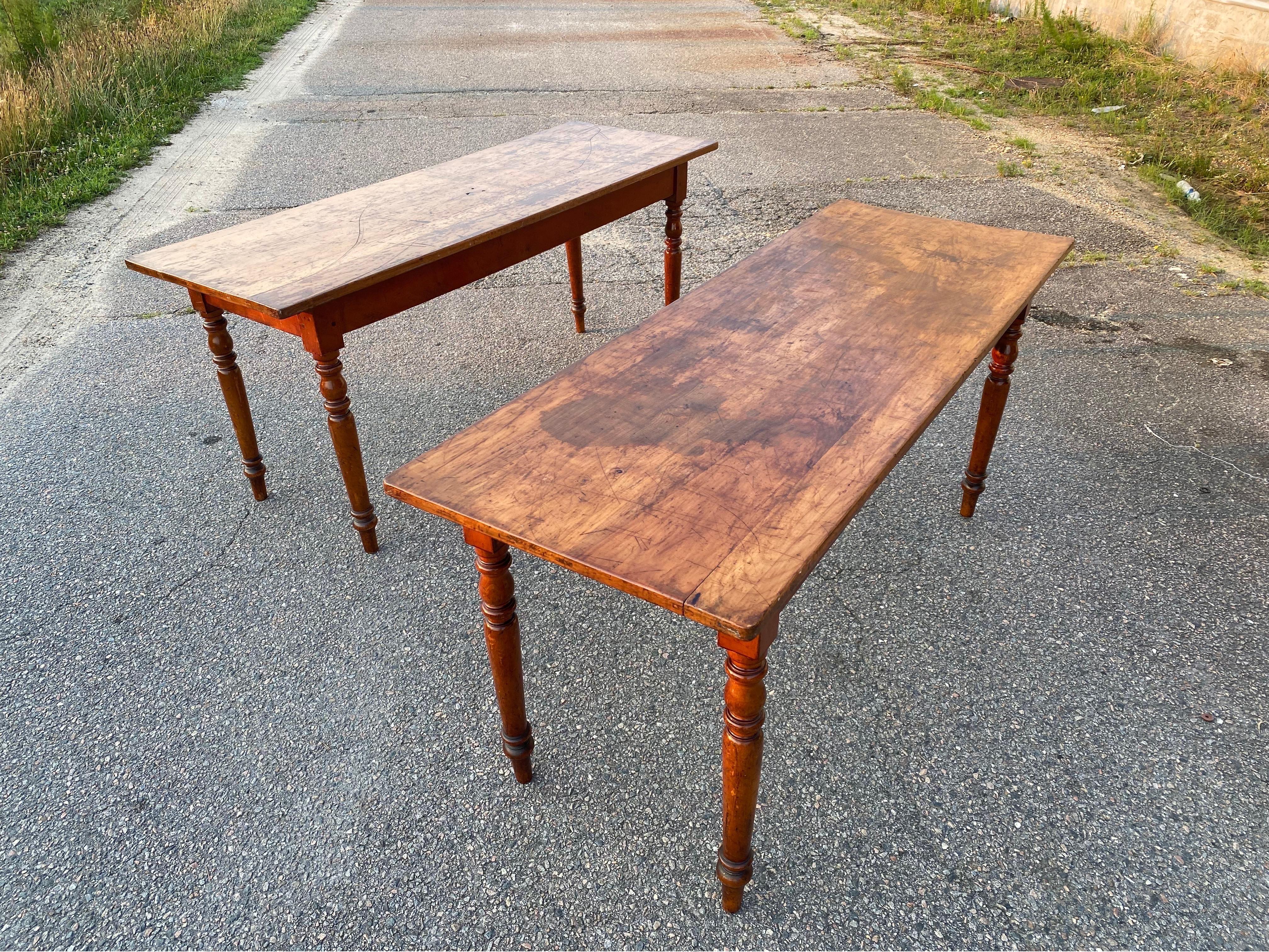 Great pair of 19th century French hunt tables with turned legs and worn tops. Perfect size and height to use as kitchen tables, work tables, consoles or as they were found- side by side in a mountain hunting lodge.