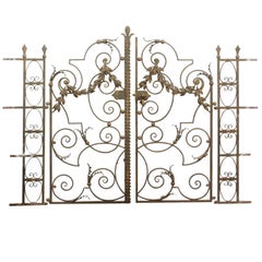 Pair of 19th Century French Iron Gates with Side Railings, Scrolls and Garlands