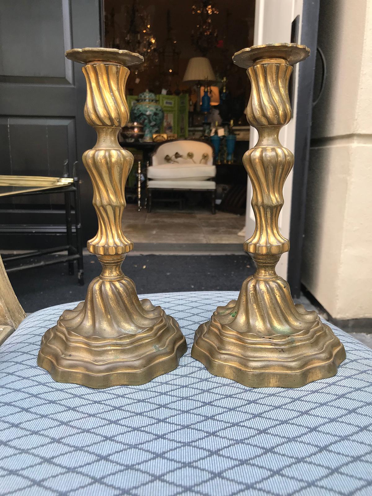 Pair of 19th century French Louis XV style brass candlesticks.