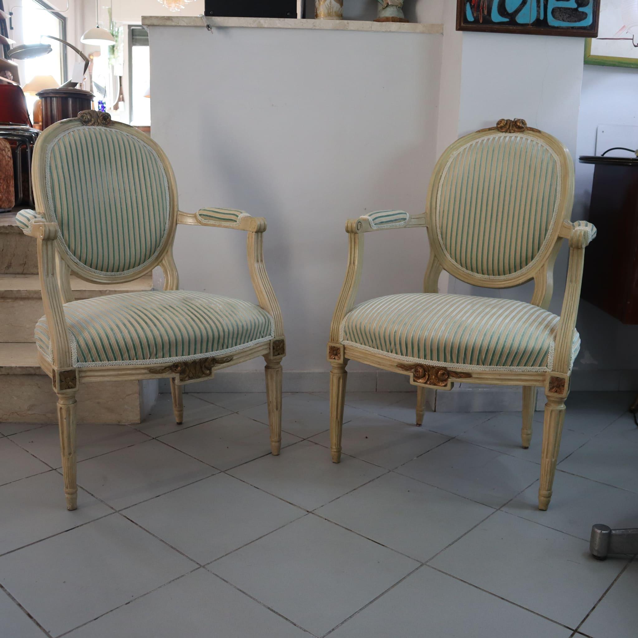 Pair of 19th Century French Louis XVI Armchairs Dining wood and gold leaf
This exquisite pair of Louis XVI armchairs dates back to the early 19th century and is a perfect example of French period craftsmanship. 

The armchairs have been expertly