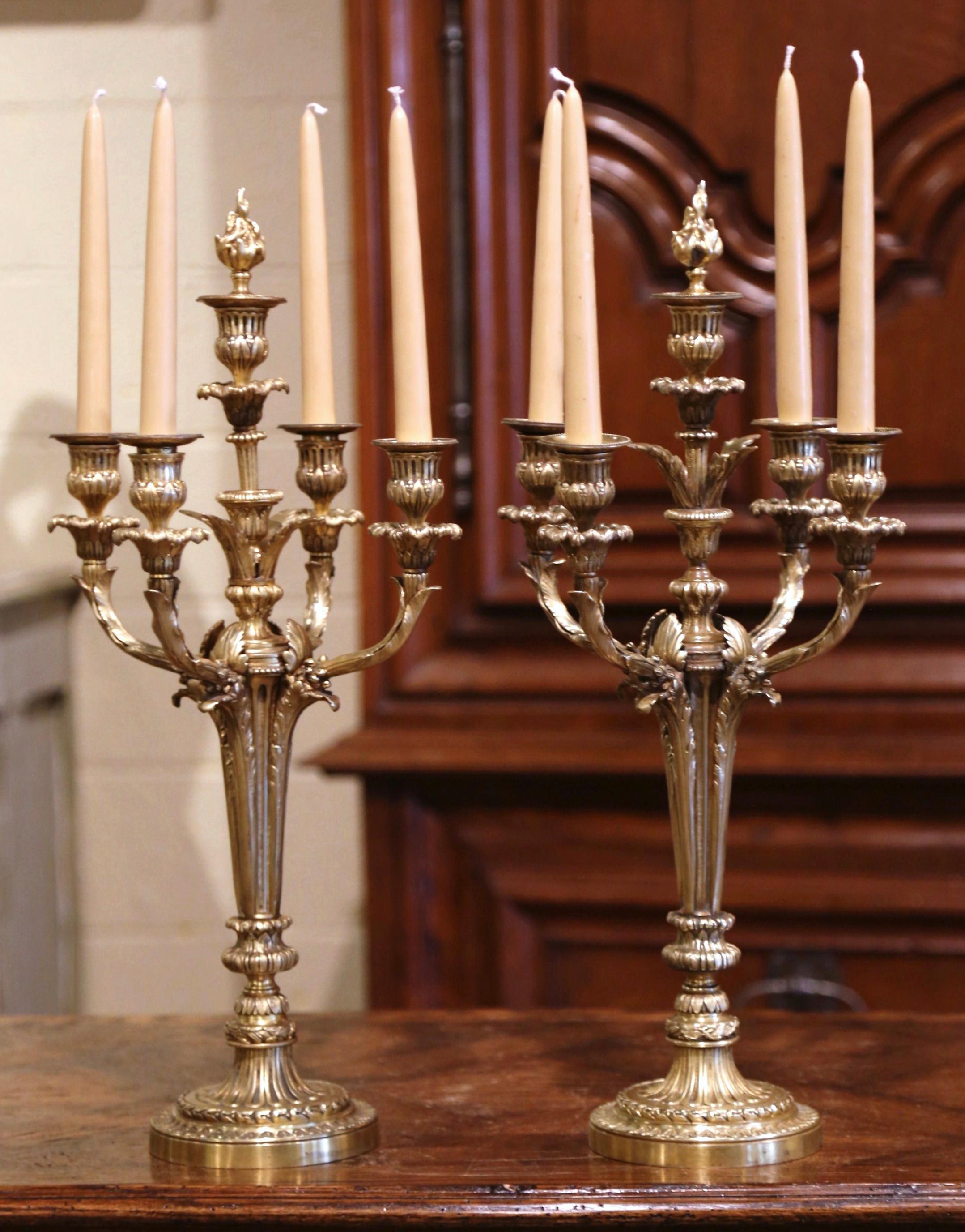 Decorate a mantel or a dining room table with this elegant pair of antique candleholders. Crafted in France circa 1870, each 