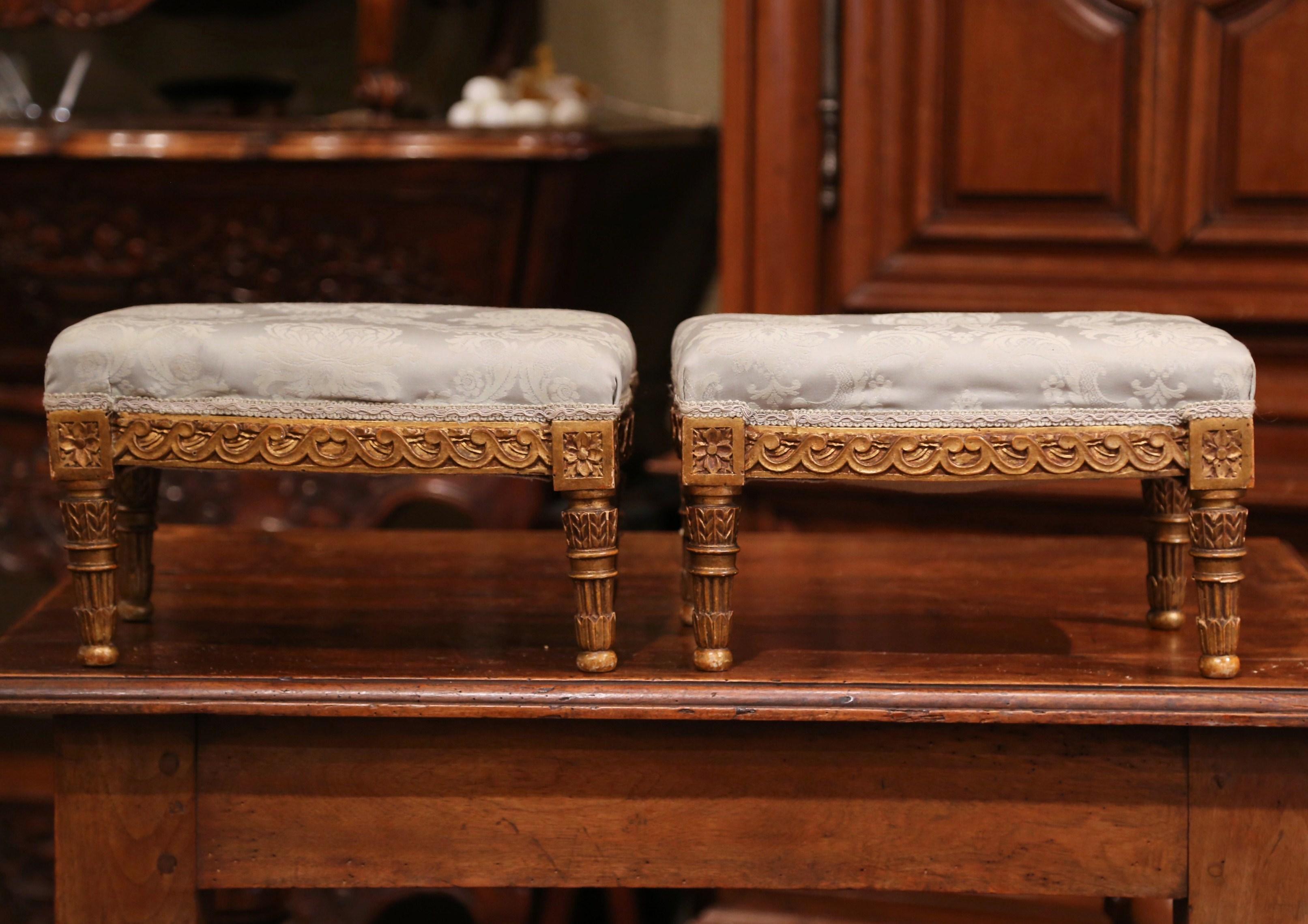 Place these elegant antique footstools near your armchairs for extra leg support. Crafted in France, circa 1880, each stool sits on four small turned legs and features bombe sides decorated with hand carved geometric motifs. In each corner, you'll