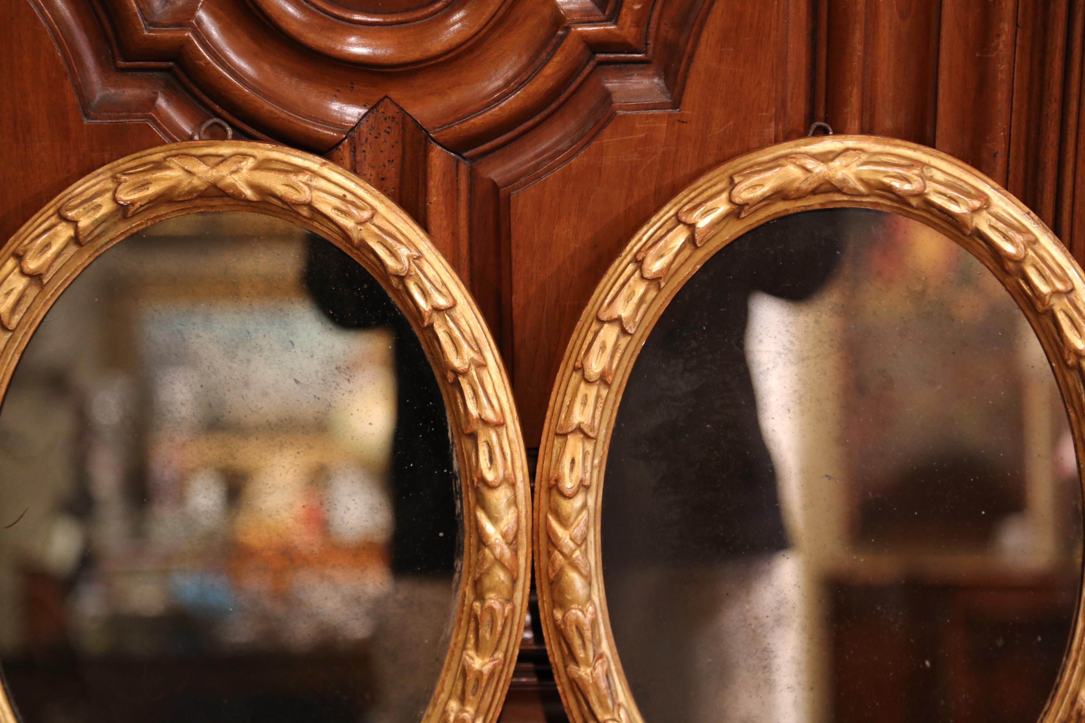 Hand-Carved Pair of 19th Century French Louis XVI Carved Giltwood Oval Wall Mirrors