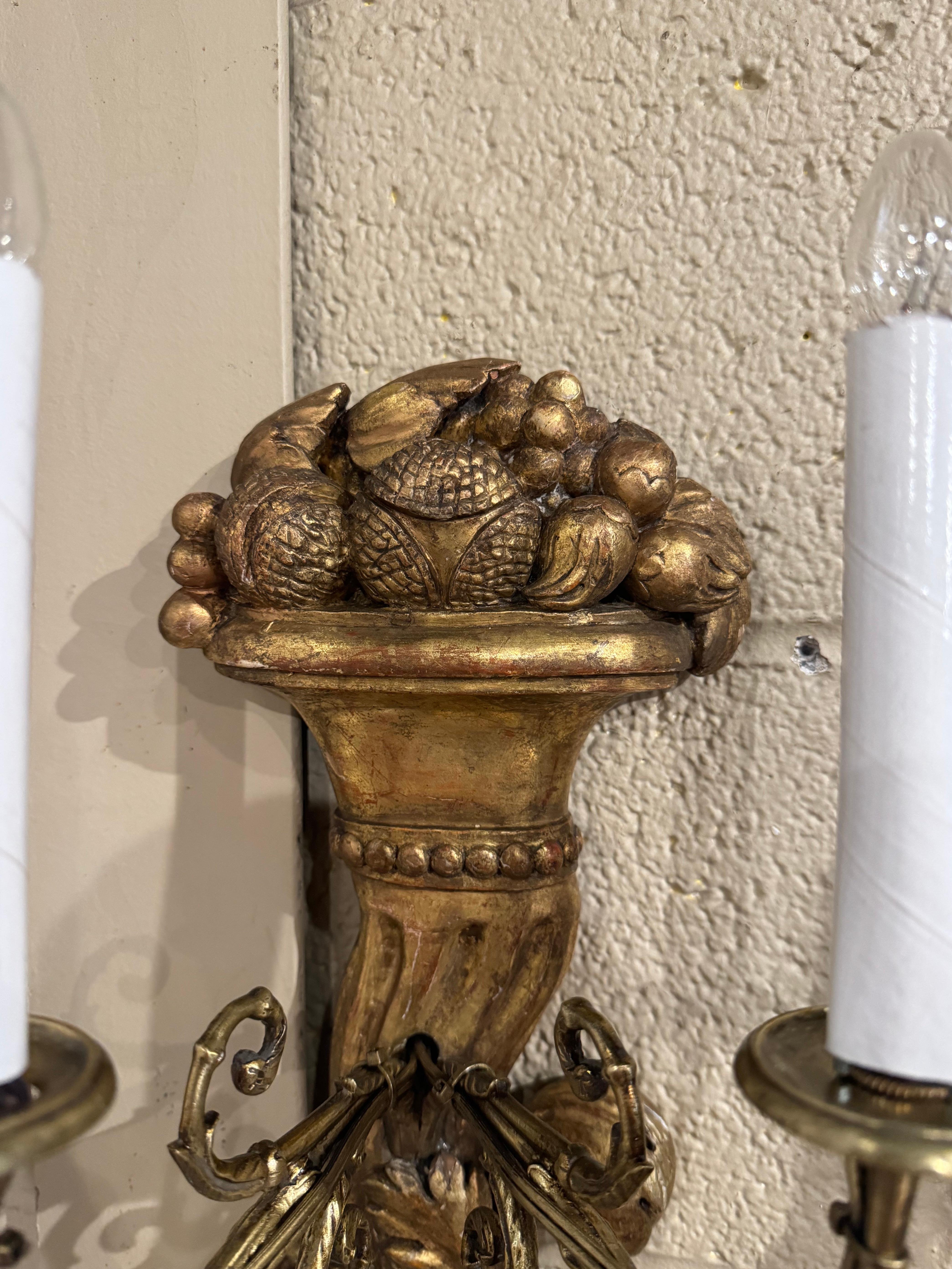 Pair of 19th Century French Louis XVI Carved Giltwood Two-Light Wall Sconces In Excellent Condition For Sale In Dallas, TX