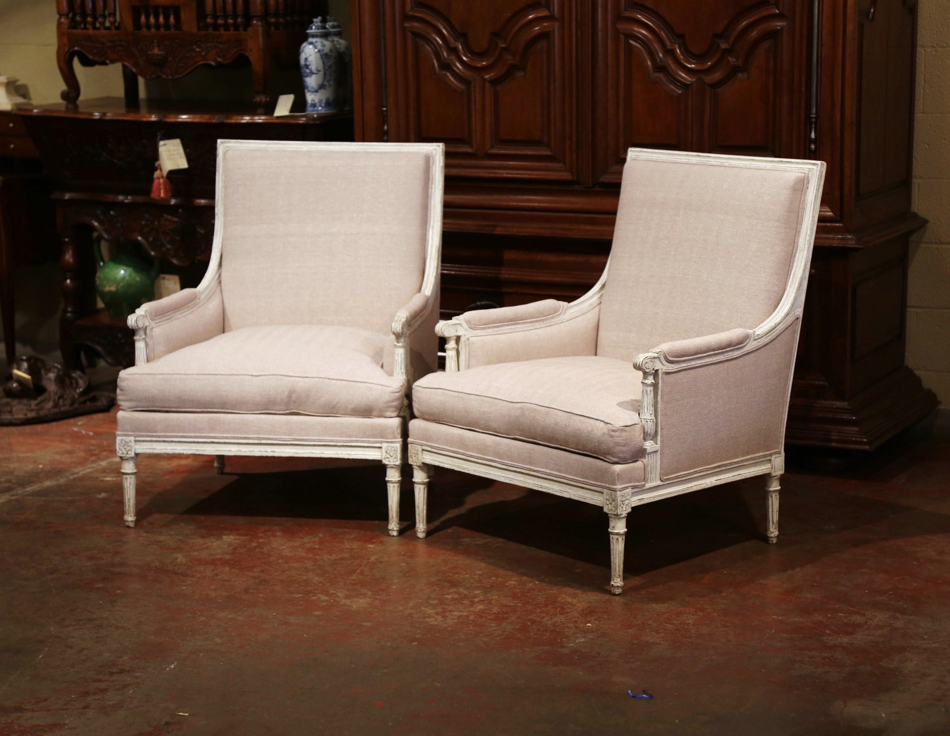 Complete your formal living room or master bedroom suite with this elegant and straight line pair of antique armchairs. Created in France, circa 1880, the large, Classic chairs have a wide and square back for a comfortable seat. The traditional