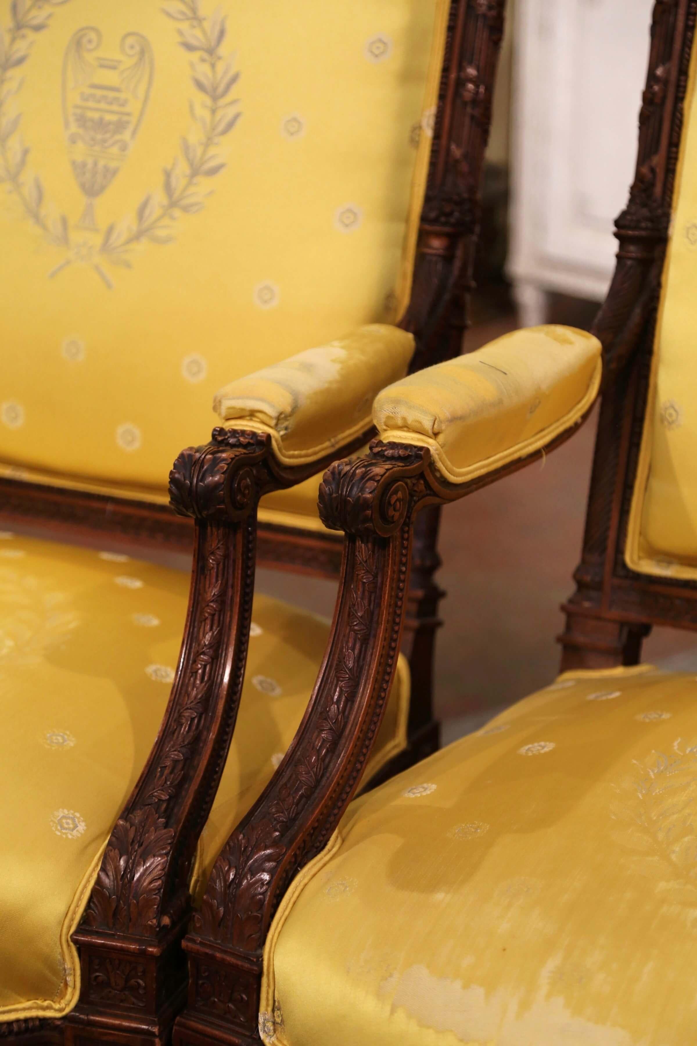 Pair of 19th Century French Louis XVI Carved Walnut Carved Fauteuils Armchairs In Fair Condition For Sale In Dallas, TX