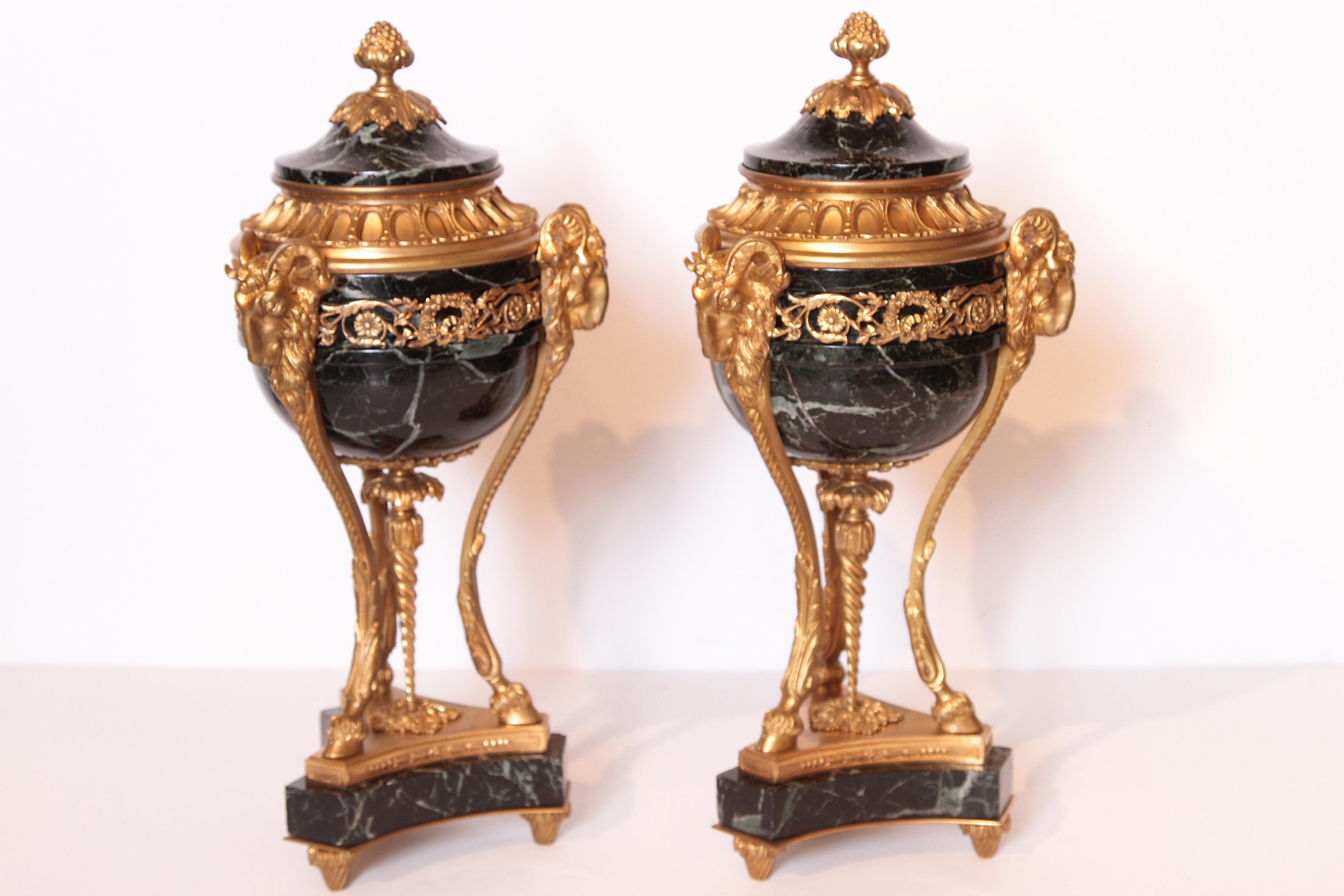 Pair of fine 19th century French Louis XVI tripod marble and gilt bronze urns with lids. Signed F. Barbedienne. Ram's head detail.