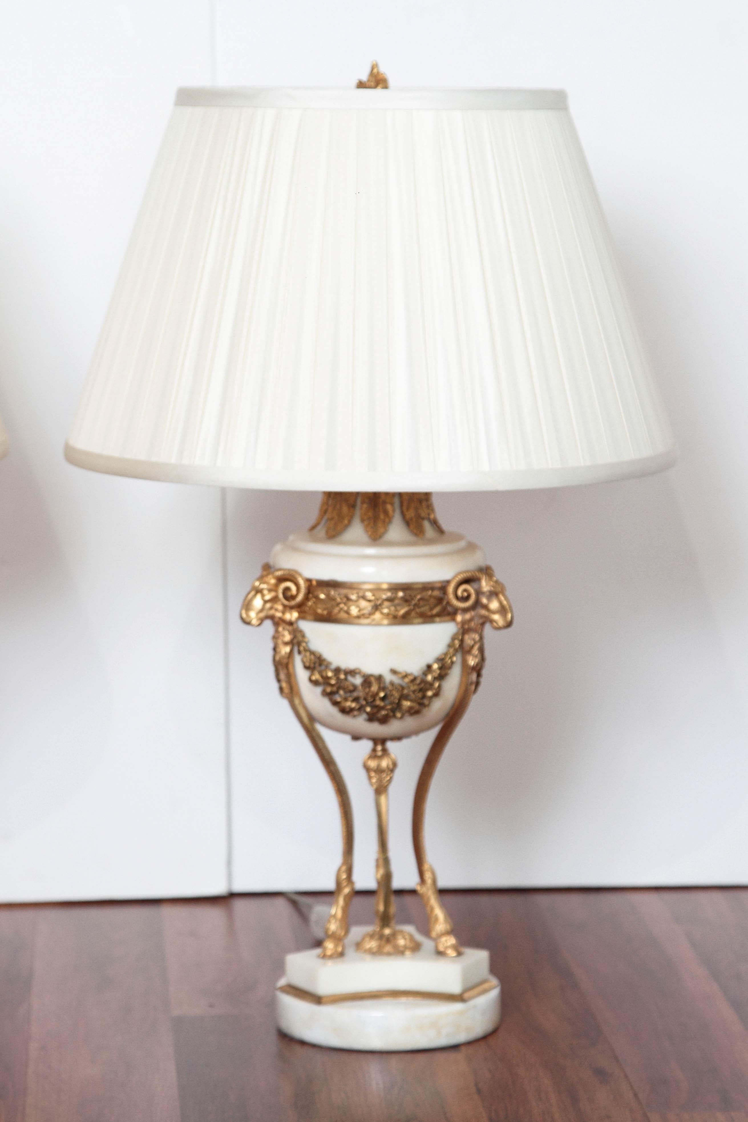 Pair of 19th century French Louis XVI Carrara marble and gilt bronze tripod urn lamps.