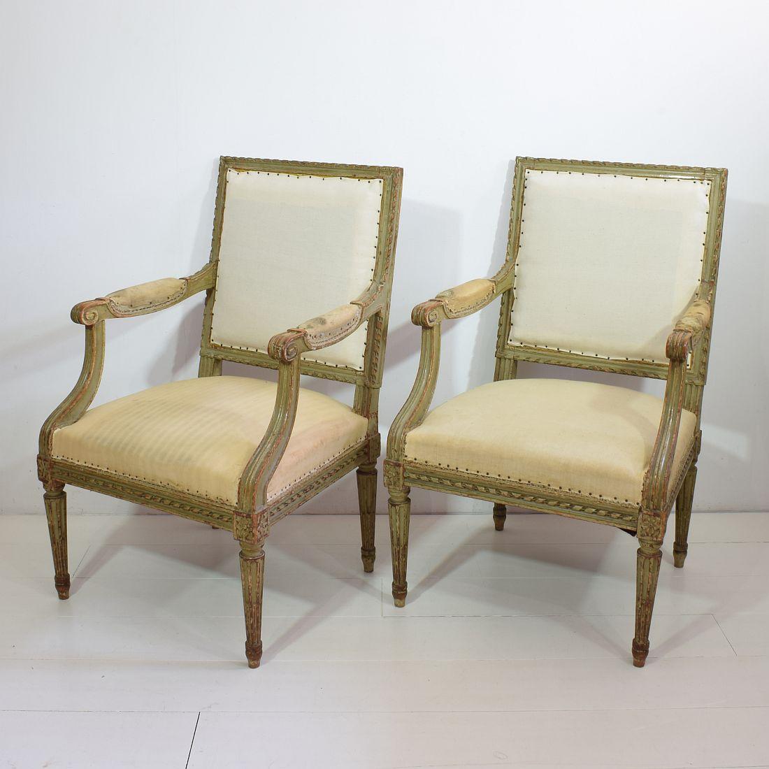 Beautiful pair of Louis XVI style armchairs, France 19th century, in beautiful weathered but structural good condition. They need new lining. 
Measure: Seat height is 42 cm. More pictures available on request.