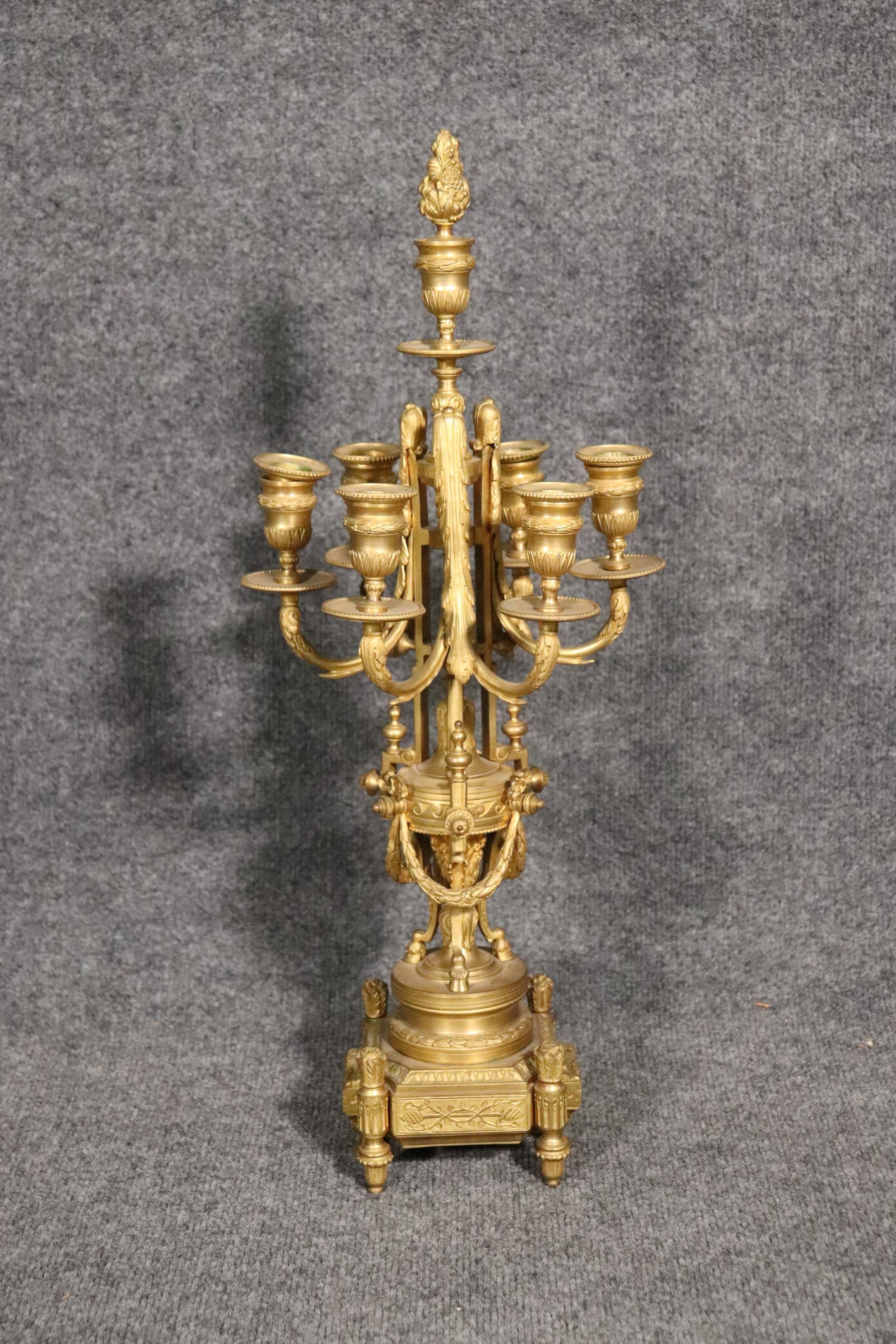 Dimensions: H: 11in W: 9.5in D: 9.5in
This beautiful pair of 19th century French Bronze Candelabras are made from the highest quality Dorè or Ormolu Bronze. The craftsmanship of these candelabras are breath taking! If you look closely you will be