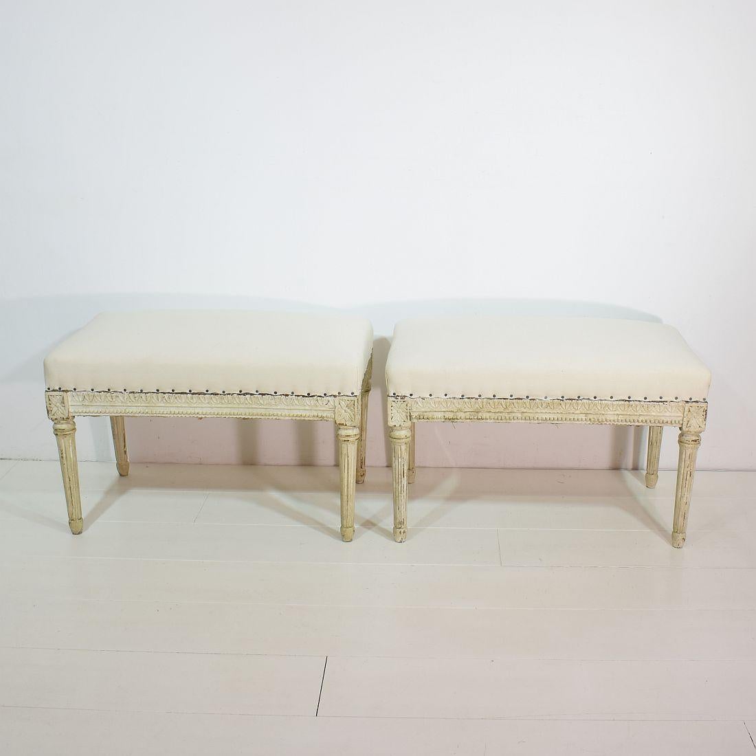 Wonderful pair of weathered Louis XVI style carved stools or tabourets. Beautiful wood carved decoration. Great size. Good condition with weathered look and ready for re-upholstery.
France, circa 1850.
 