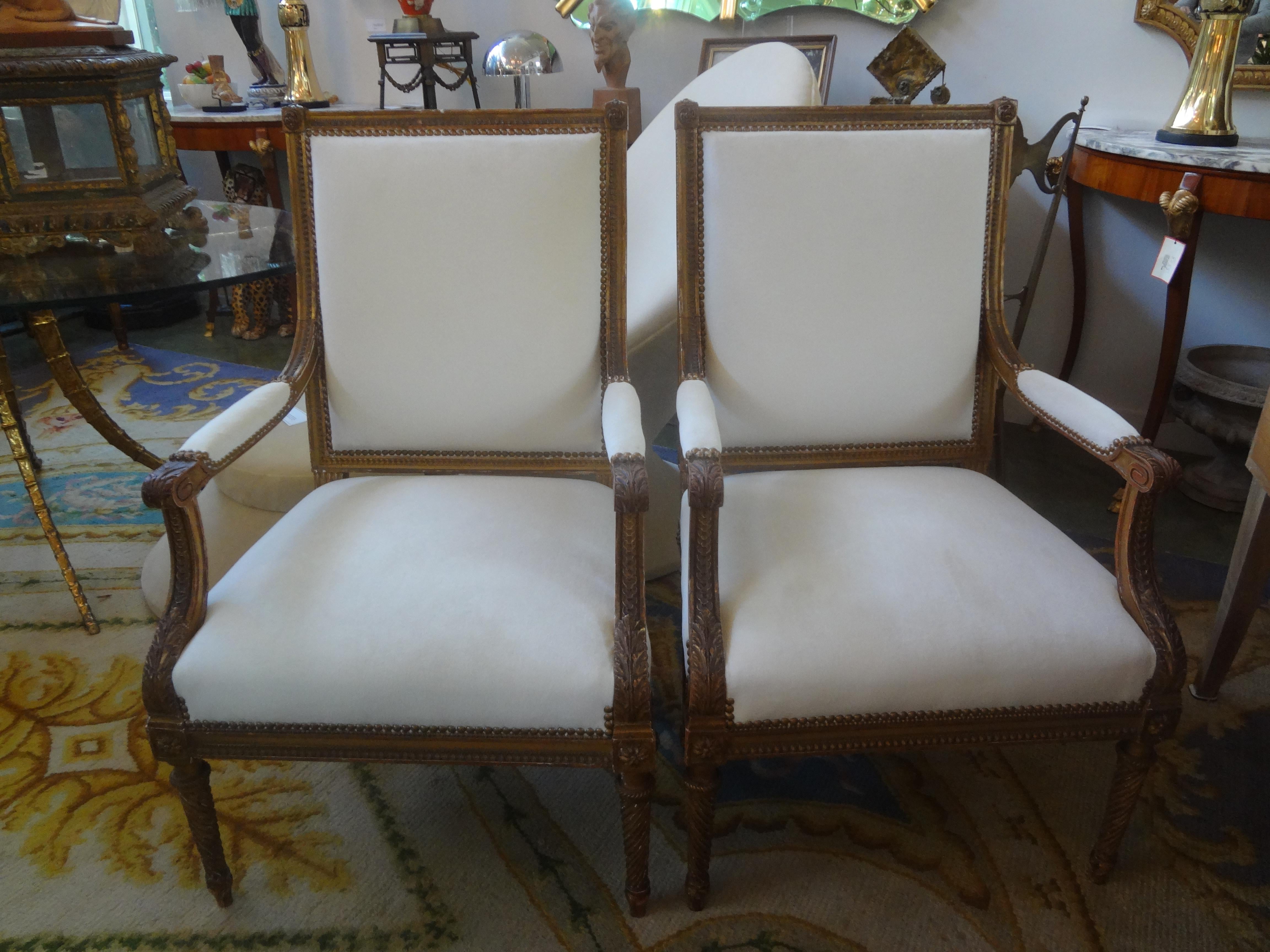 Pair of 19th century French Louis XVI style giltwood chairs.
This pair of generous size superior quality French Louis XVI style gilt wood chairs, armchairs, side chairs or fauteuils have been professionally upholstered in luxe low pile mohair type