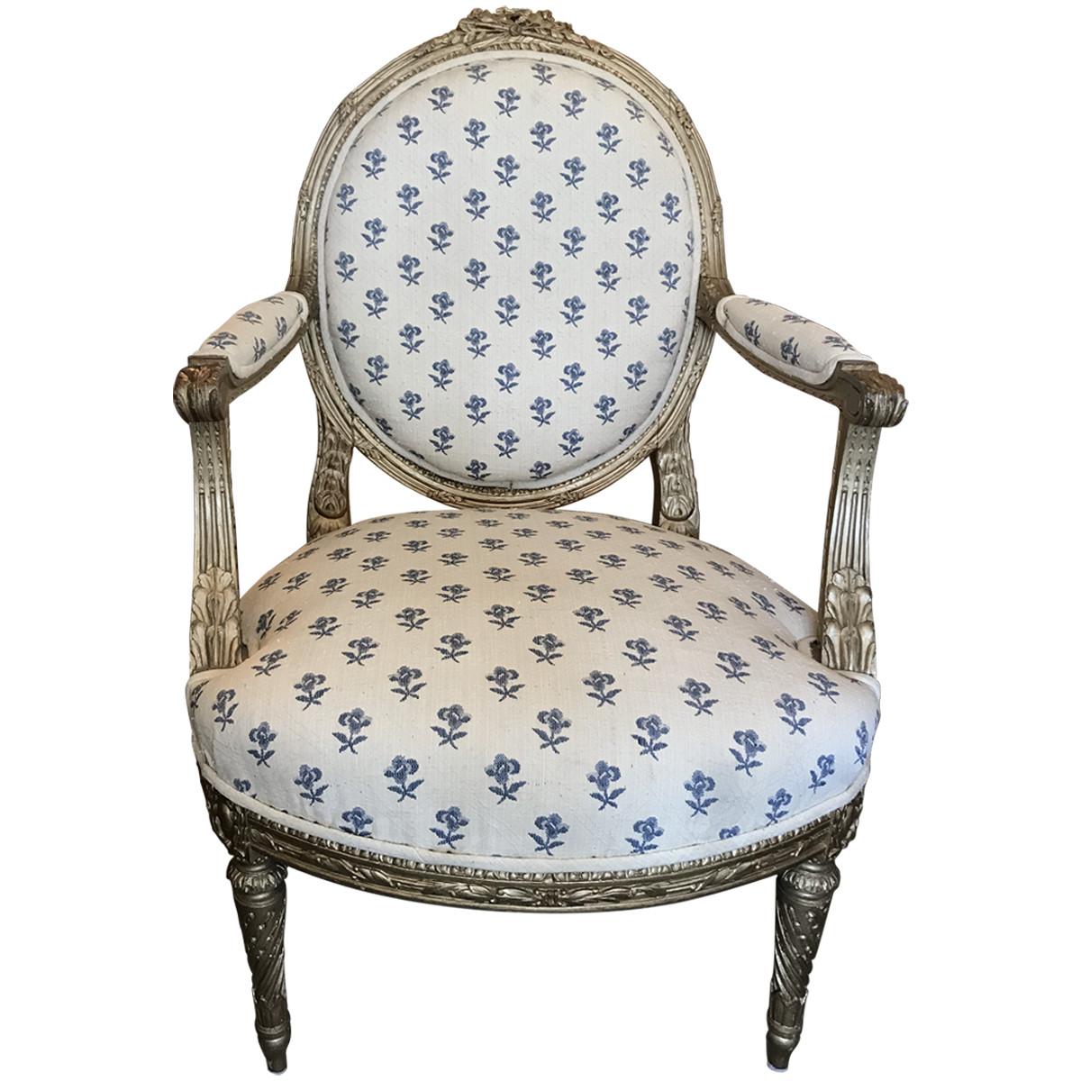 A collectible piece from bygone days, featuring the finest craftsmanship, materials, and design elements of its given era. Dating to the 19th century, these giltwood fauteuils are designed in the French Louis XVI style. They are made with oval