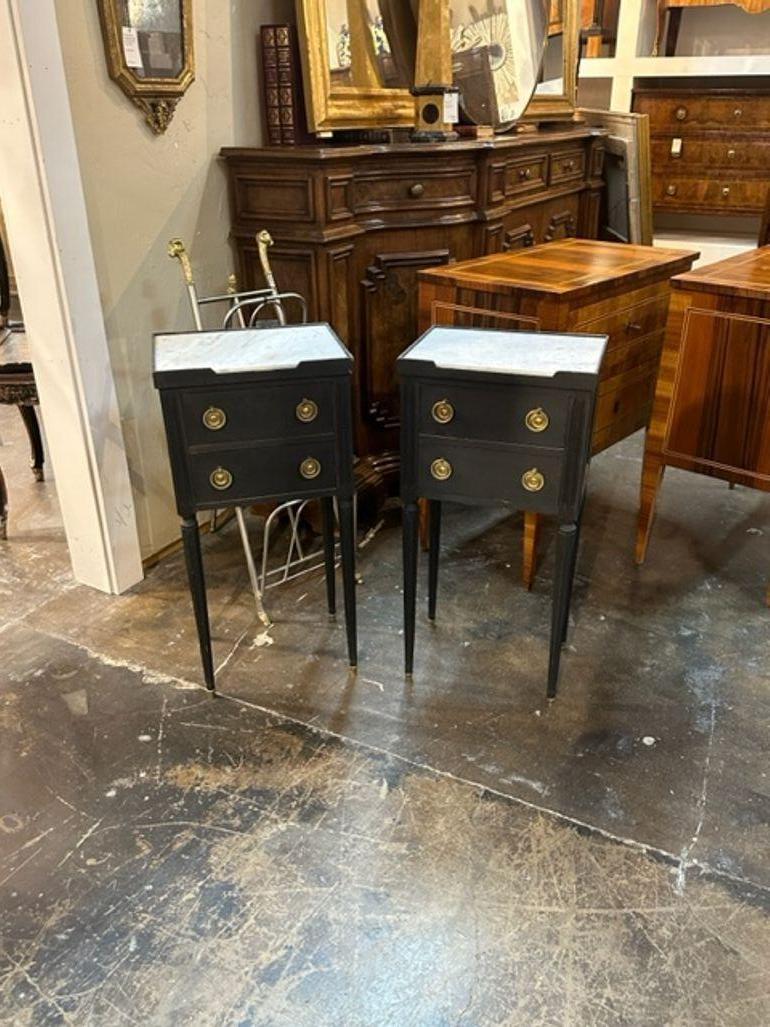 Handsome pair of 19th century French Louis XVI style painted drink tables. Very nice hardware along beautiful marble tops make these super nice!