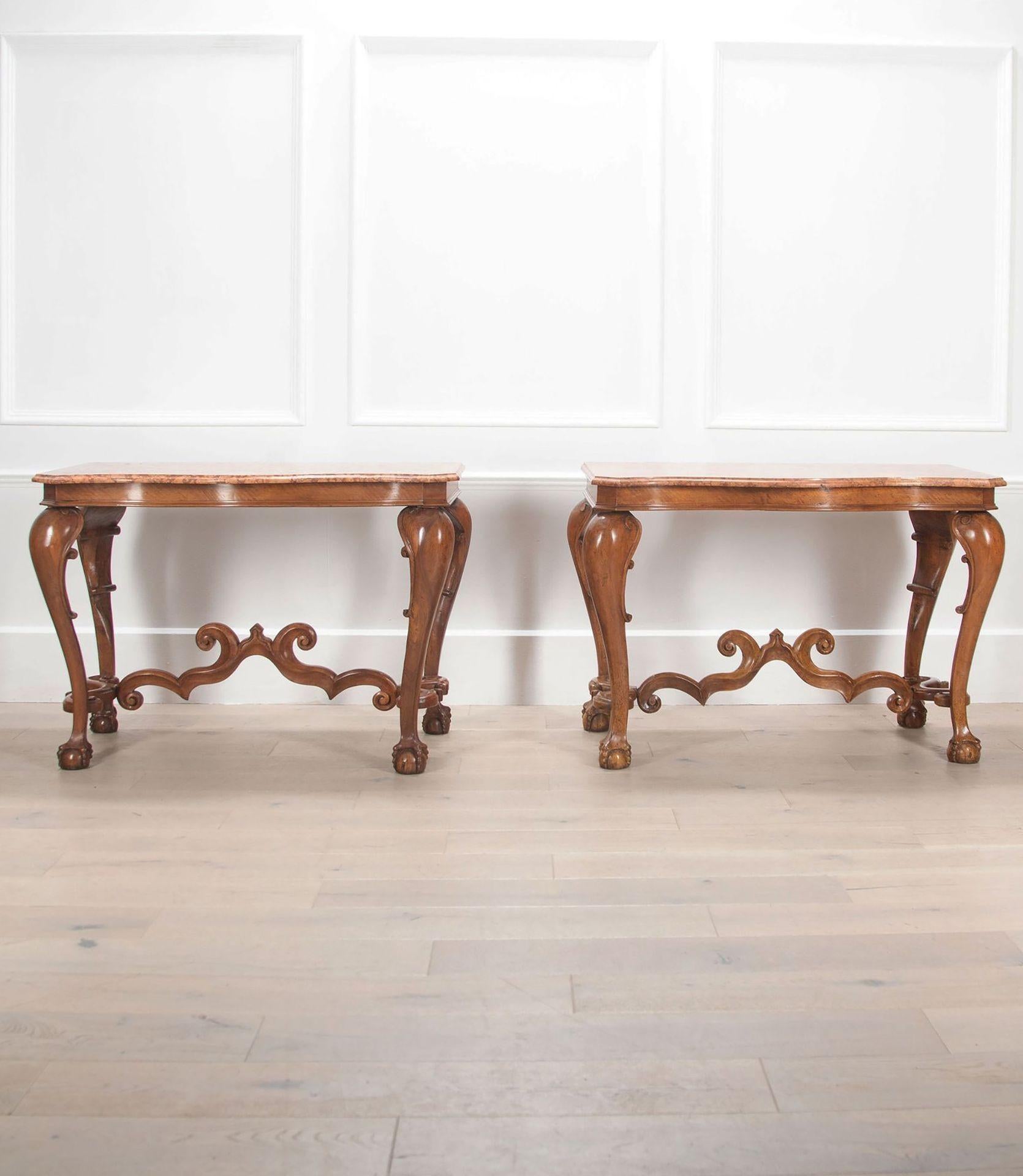 Pair of 19th Century French walnut console tables on cabriole legs.
Finished on a ball and claw feet with a decorative connecting stretcher.
With their original marble top, in good condition.