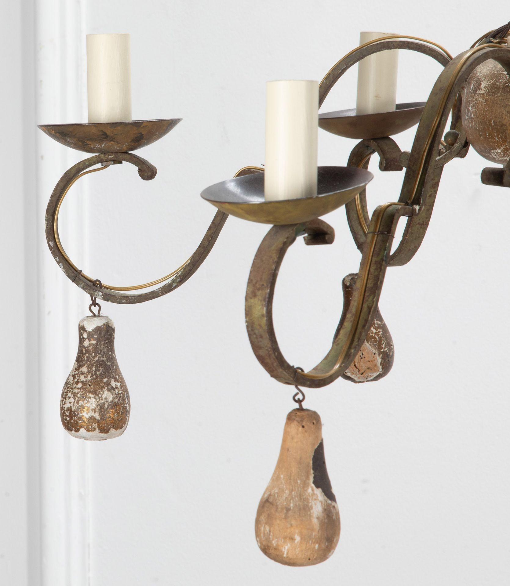 Pair of six arm 19th Century French chandeliers.
In iron with gilded drops and a crown shaped hanging mount.
