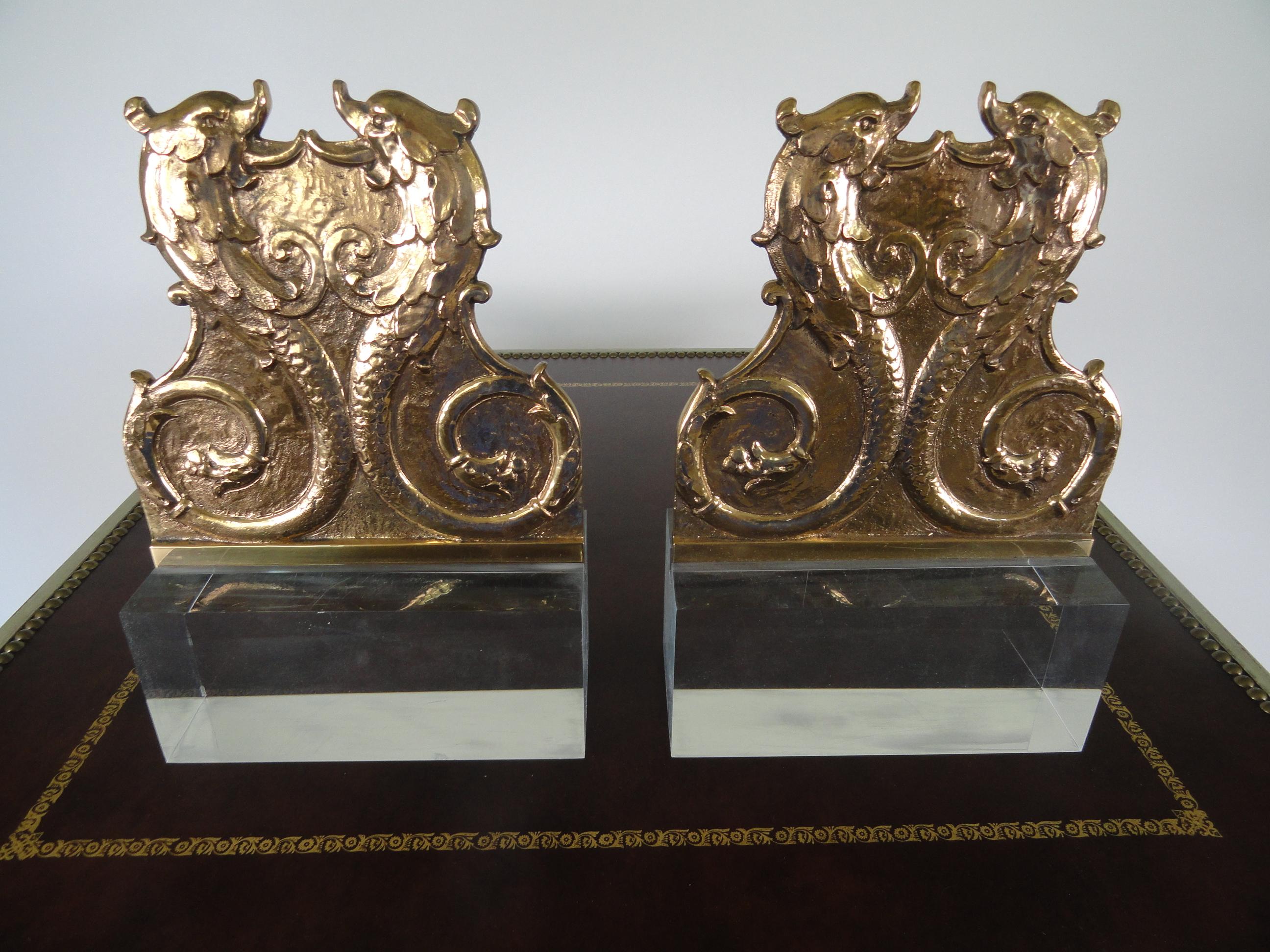 Pair of 19th century French decor dolphin plaques mounted on new, custom clear acrylic bases.