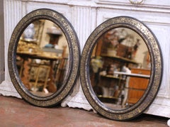 Pair of 19th Century French Napoleon III Black and Gold Oval Wall Mirrors