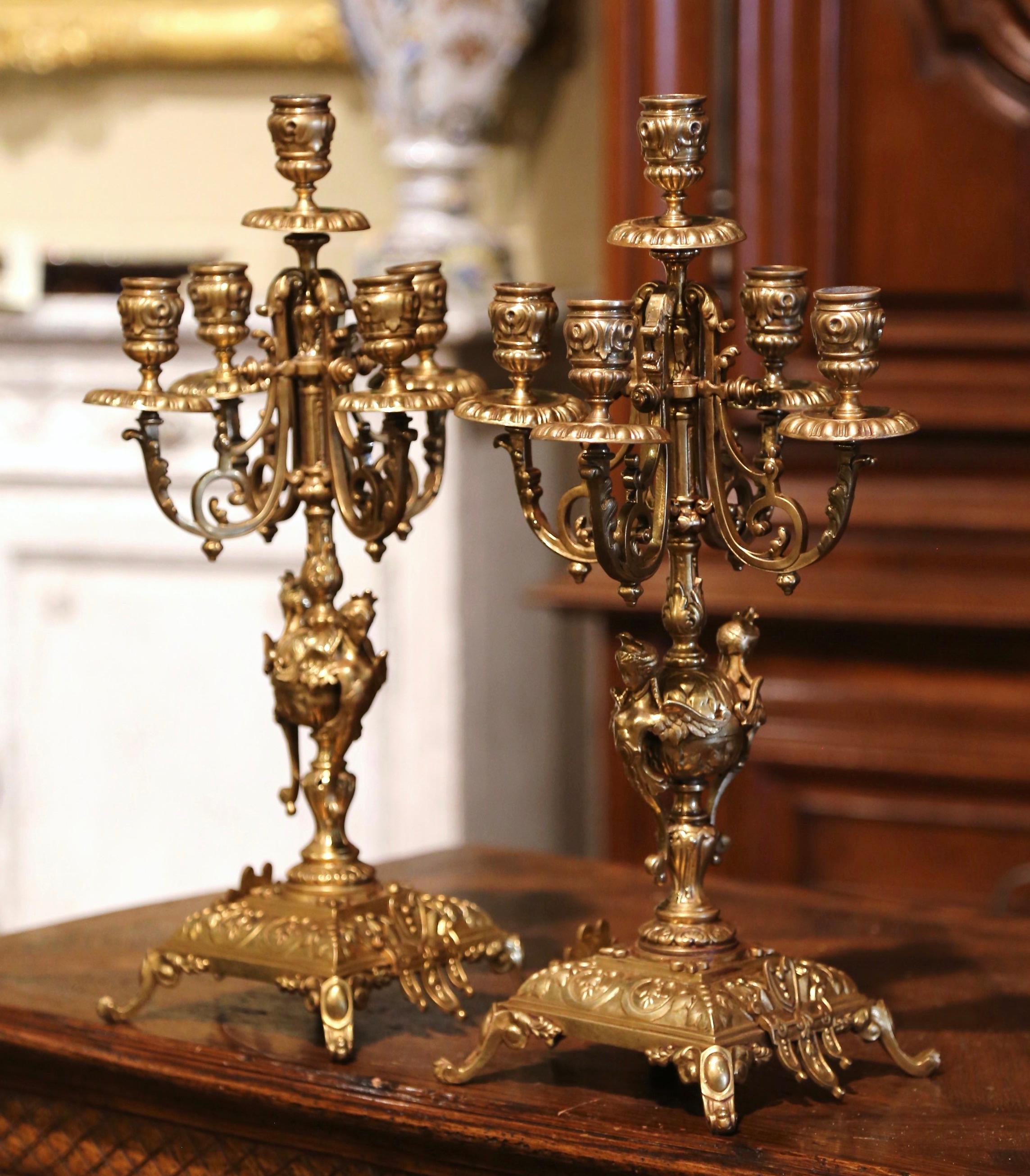Decorate a mantel or a dining room table with this elegant pair of antique candle holders. Crafted in France circa 1880, each bronze 
