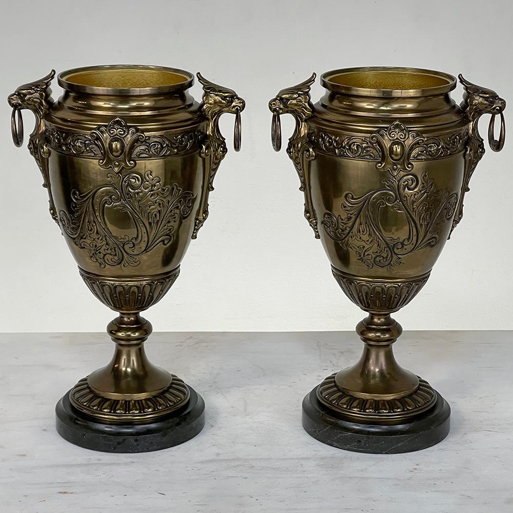 Pair of 19th Century French Napoleon III Period Bronze & Brass Urns represent the mastery of metal sculpture exhibited by the French during this wonderful era and are of a nice size and weight to add a great symmetrical accent to your decor. The