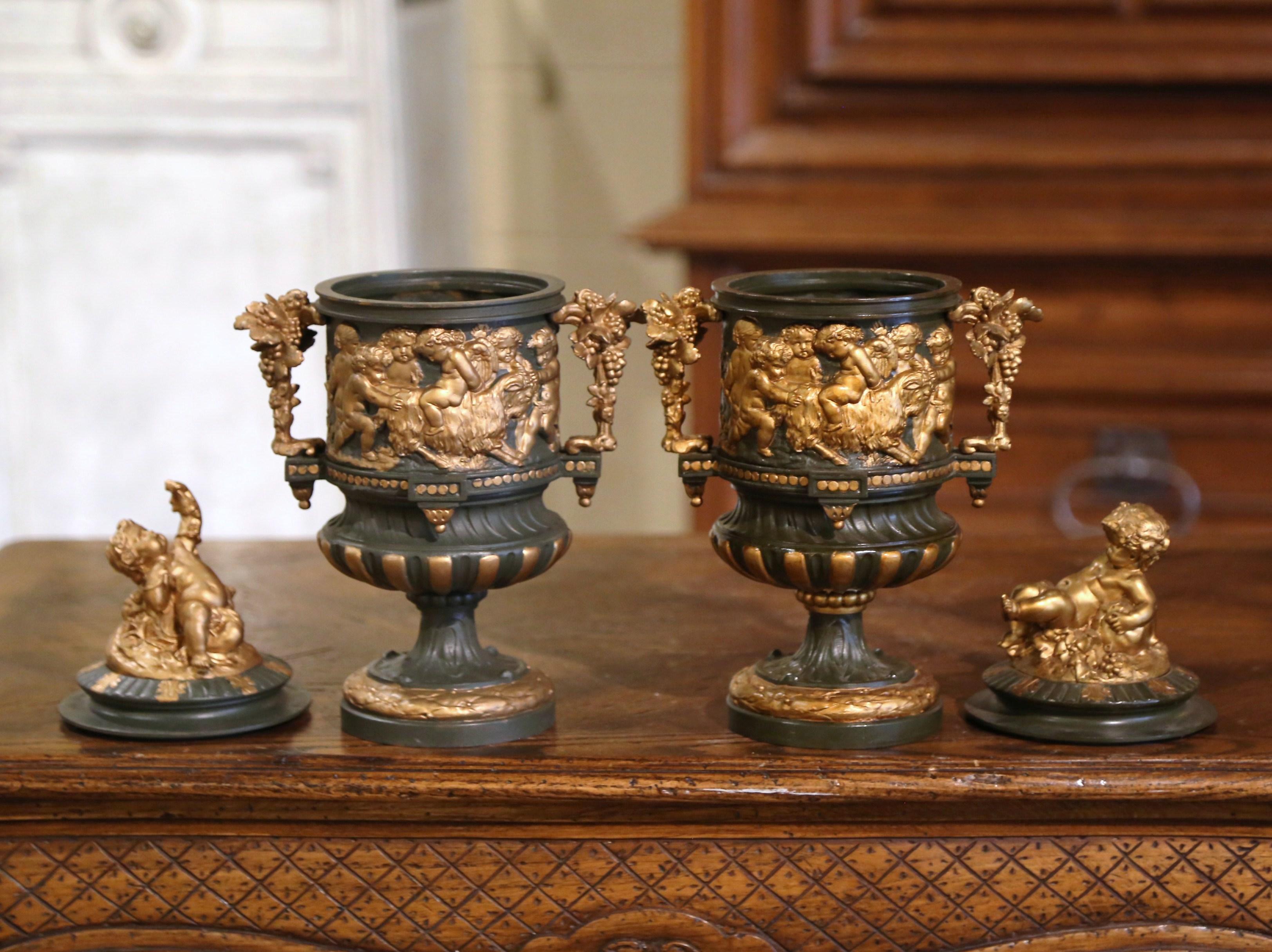 Crafted in France circa 1880 in the neoclassical style, these colorful antique urns have a truly elegant style. Each bronze vase stands on a circular base over a circular foot; the removable lid features a young Bacchus seated on vine and leaves