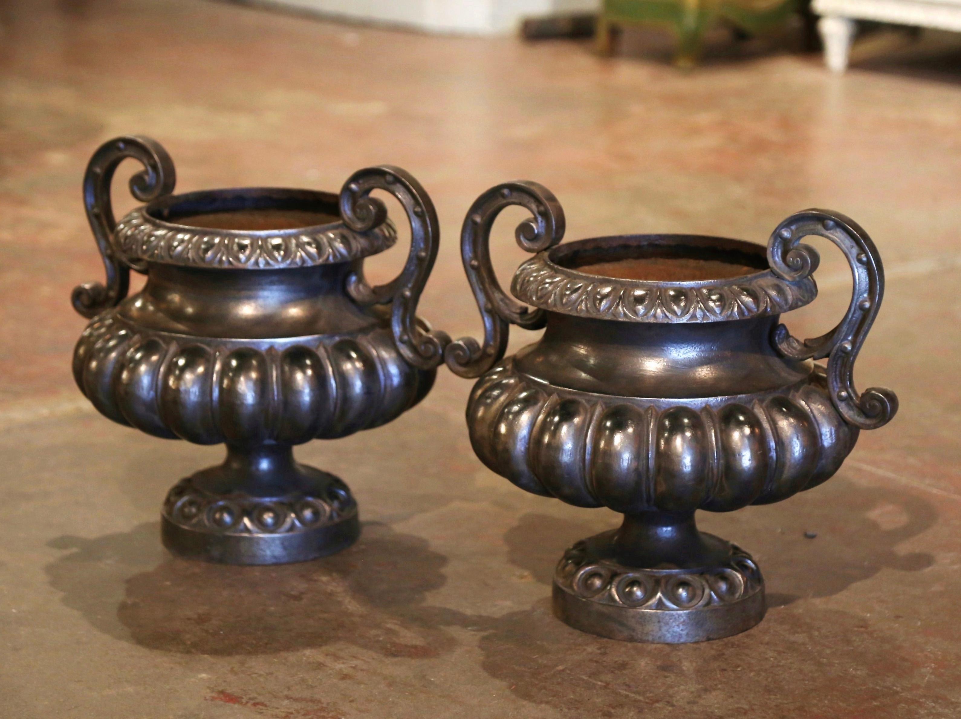 Pair of 19th Century French Neoclassical Polished Iron Garden Urn Planters In Excellent Condition For Sale In Dallas, TX