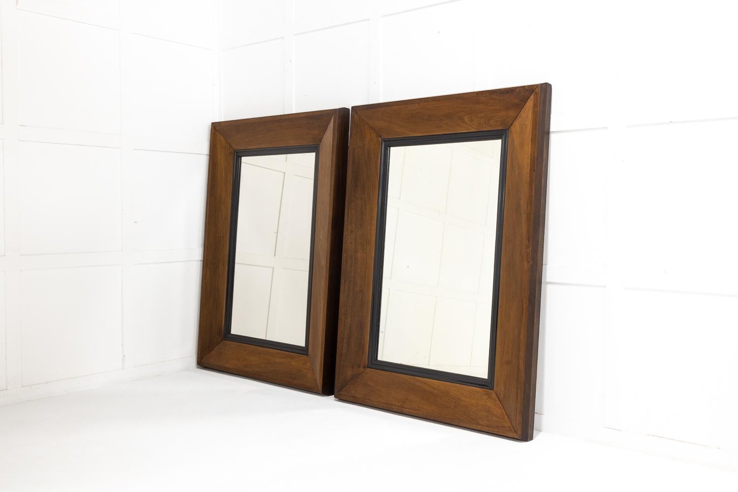 An attractive large pair of 19th Century French mirrors with simple wide oak frames and ebonised slips.

Contemporary lines suiting both classical and modern rooms alike.
 