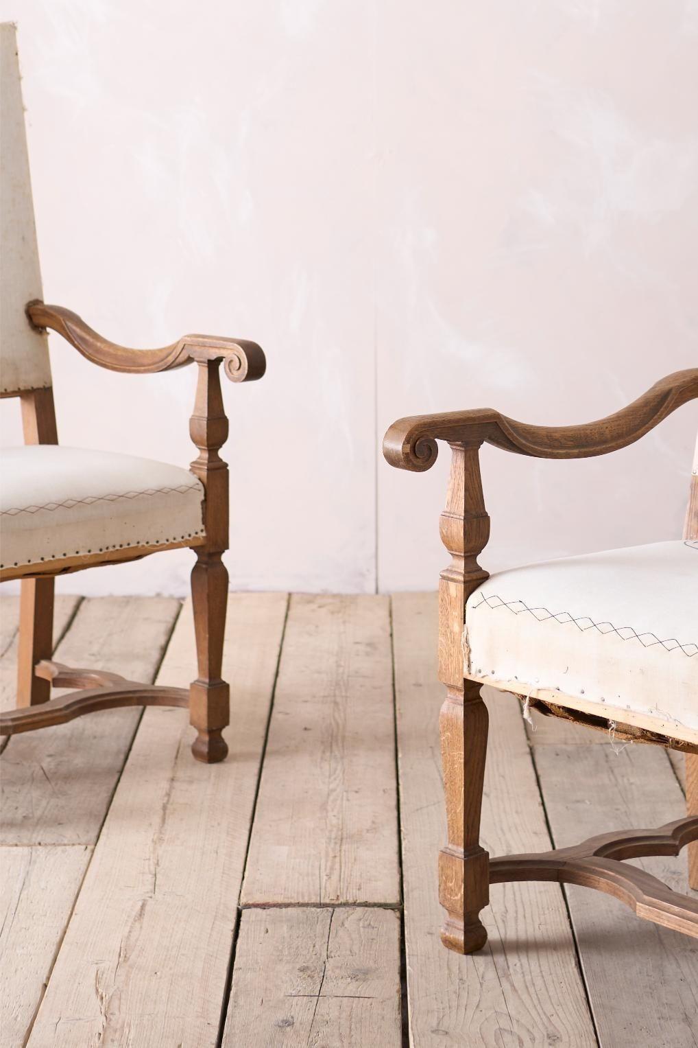 These are a very stylish, late 19th century pair of French open armchairs. Made from oak with a great shaped stretcher. The quality is very high and the design is classic that I believe will work well in a great number of interiors. The shaped arm