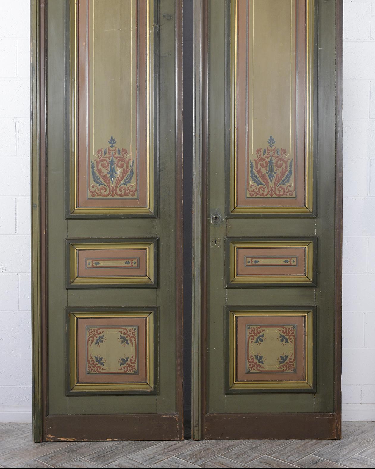 A remarkable pair of architectural doors beautiful crafted from maple wood. This set of paneling doors future an original green and dark grey color combination with two-sided eye-catching hand painted details, the set of doors are a great addition