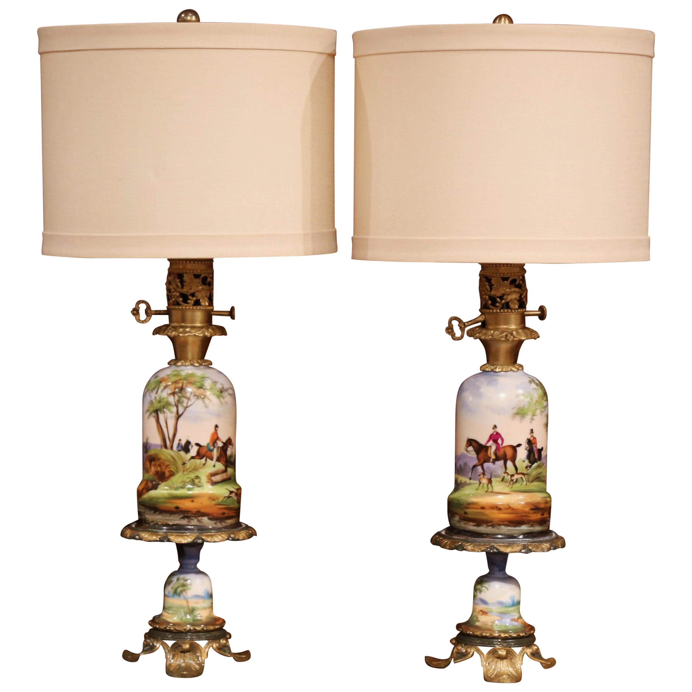 Pair of 19th Century French Painted Porcelain & Brass Oil Lamps with Hunt Scenes