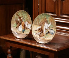 Paar französische bemalte Porzellan-Wandteller des 19. Jahrhunderts mit Jagdmotiven
