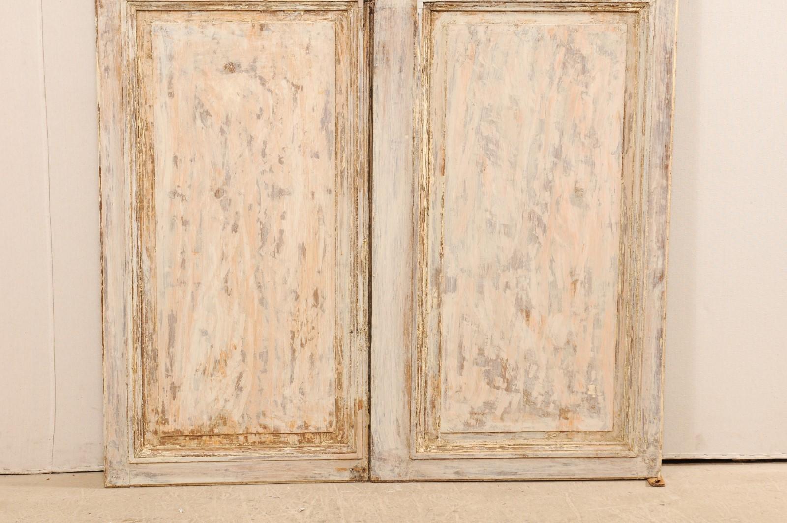 Carved Pair of 19th Century French Painted Wood Doors with Lovely Cream Colored Finish