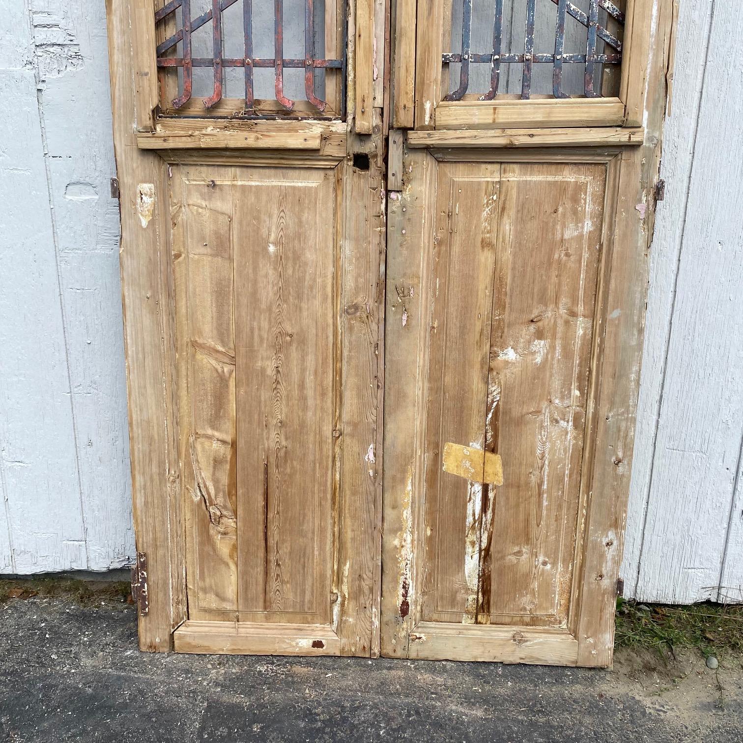 Pair of 19th Century French Paneled Doors with Intricate Wrought Iron Panels In Good Condition For Sale In Hopewell, NJ
