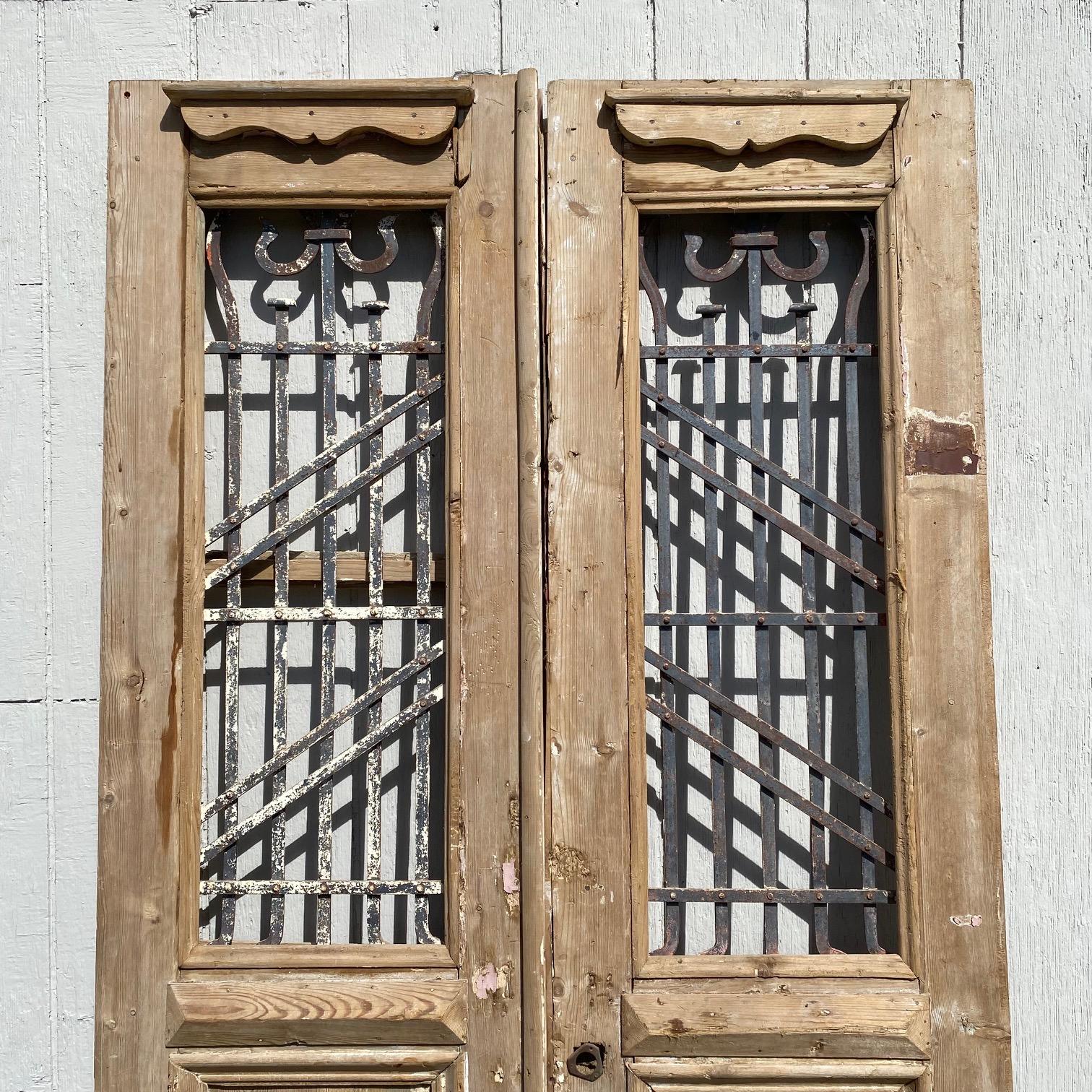 Pair of 19th Century French Paneled Doors with Intricate Wrought Iron Panels For Sale 5