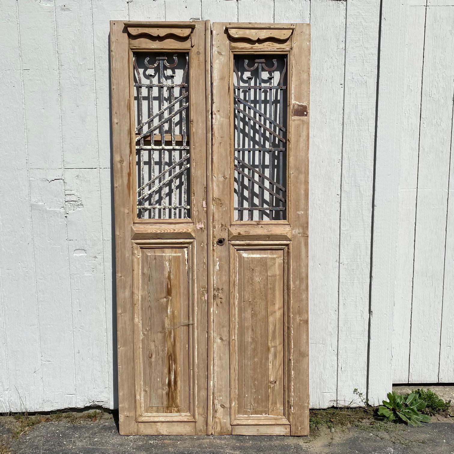 Pair of 19th Century French Paneled Doors with Intricate Wrought Iron Panels For Sale 6
