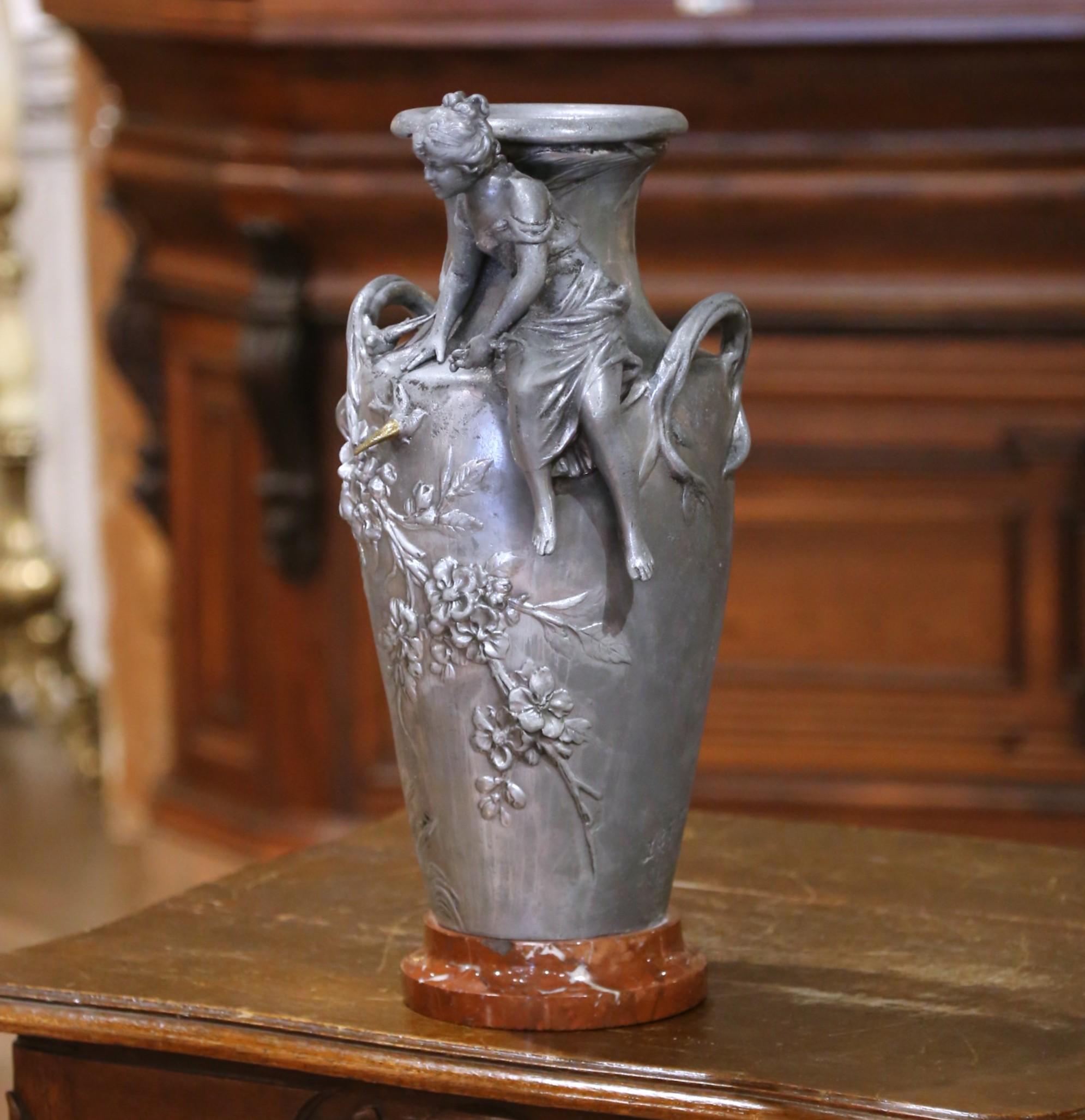 This evocative pair of French pewter vases was crafted circa 1860 and reflects the Romantic era’s fascination with nature and allegory. Standing 18.5 inches high and measuring 9 inches in diameter, each vase features richly textured decoration in