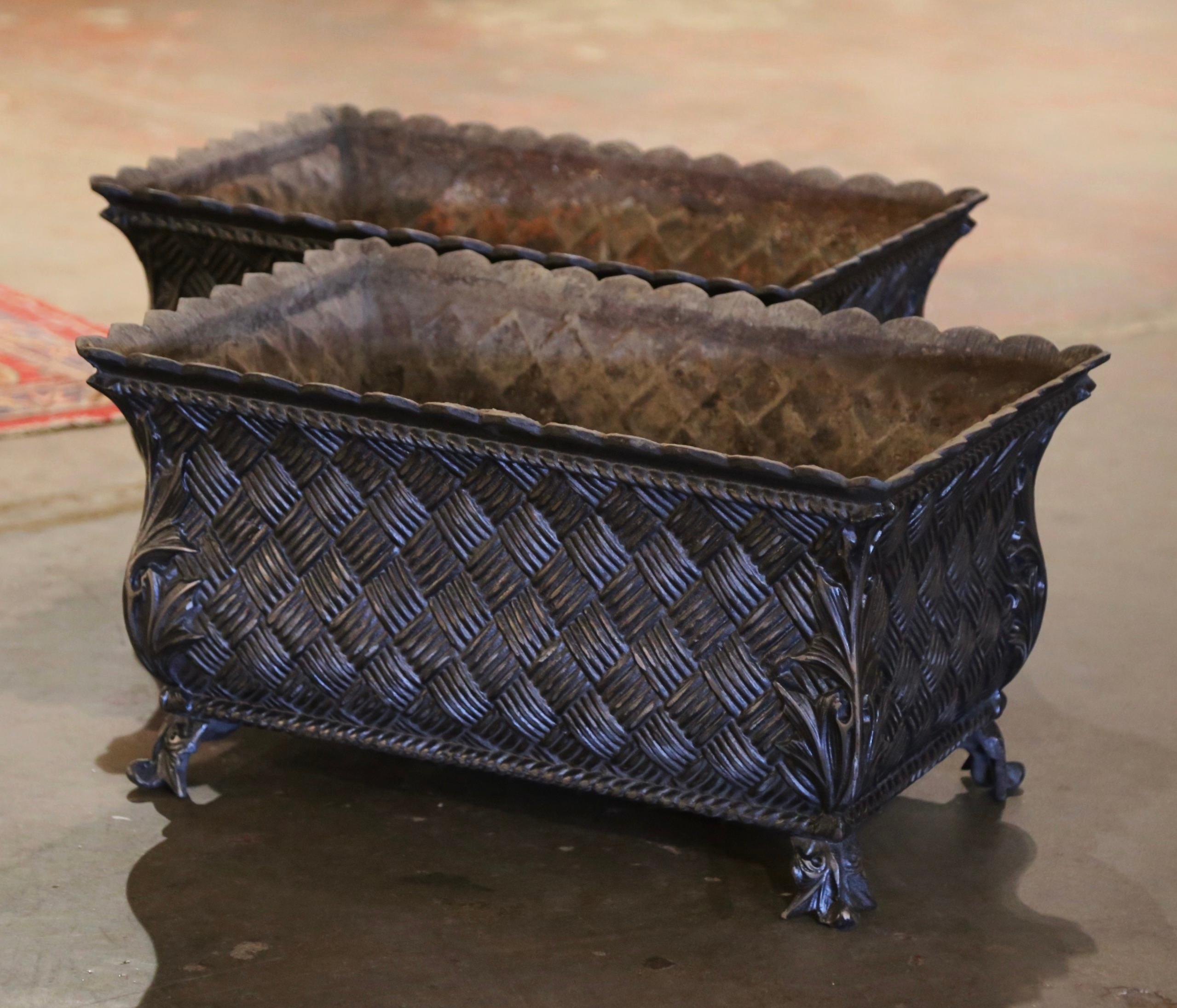 Stage your backyard or garden with this elegant pair of antique planters. Crafted in France circa 1850 and rectangular in shape, each jardinière stands on small feet decorated with acanthus leaf motifs at the shoulder, over a bombe and serpentine