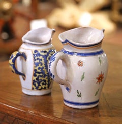 Pair of 19th Century French Quimper Faience Jugs with Breton Figures and Floral