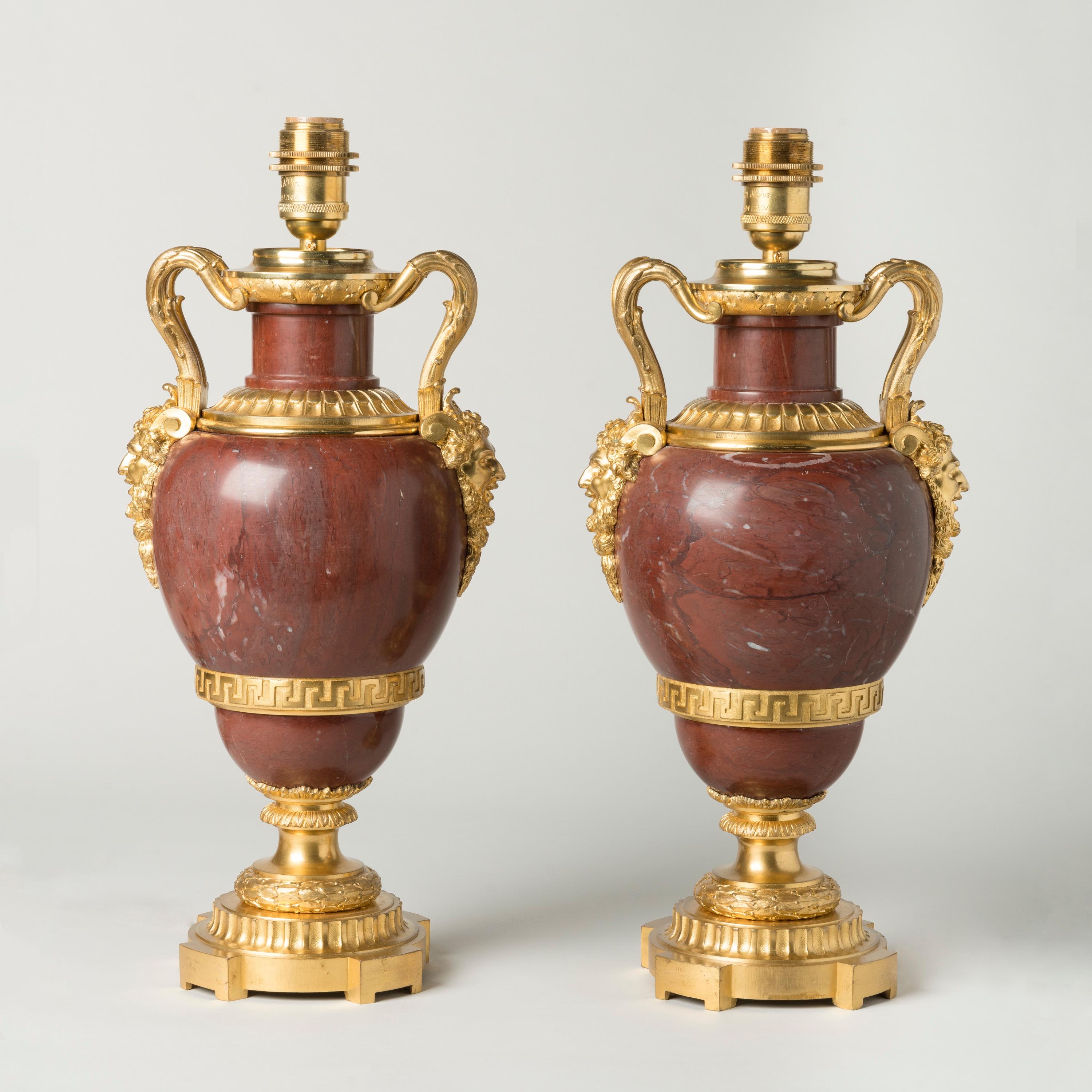 A Pair of French Ormolu-Mounted Red Marble Lamps

Constructed from a deep red 'Rouge Languedoc' marble, the ovoid vases decorated with fine gilt bronze mounts including the laurel wreaths resting on the fluted plinths, Greek scroll bands, and the