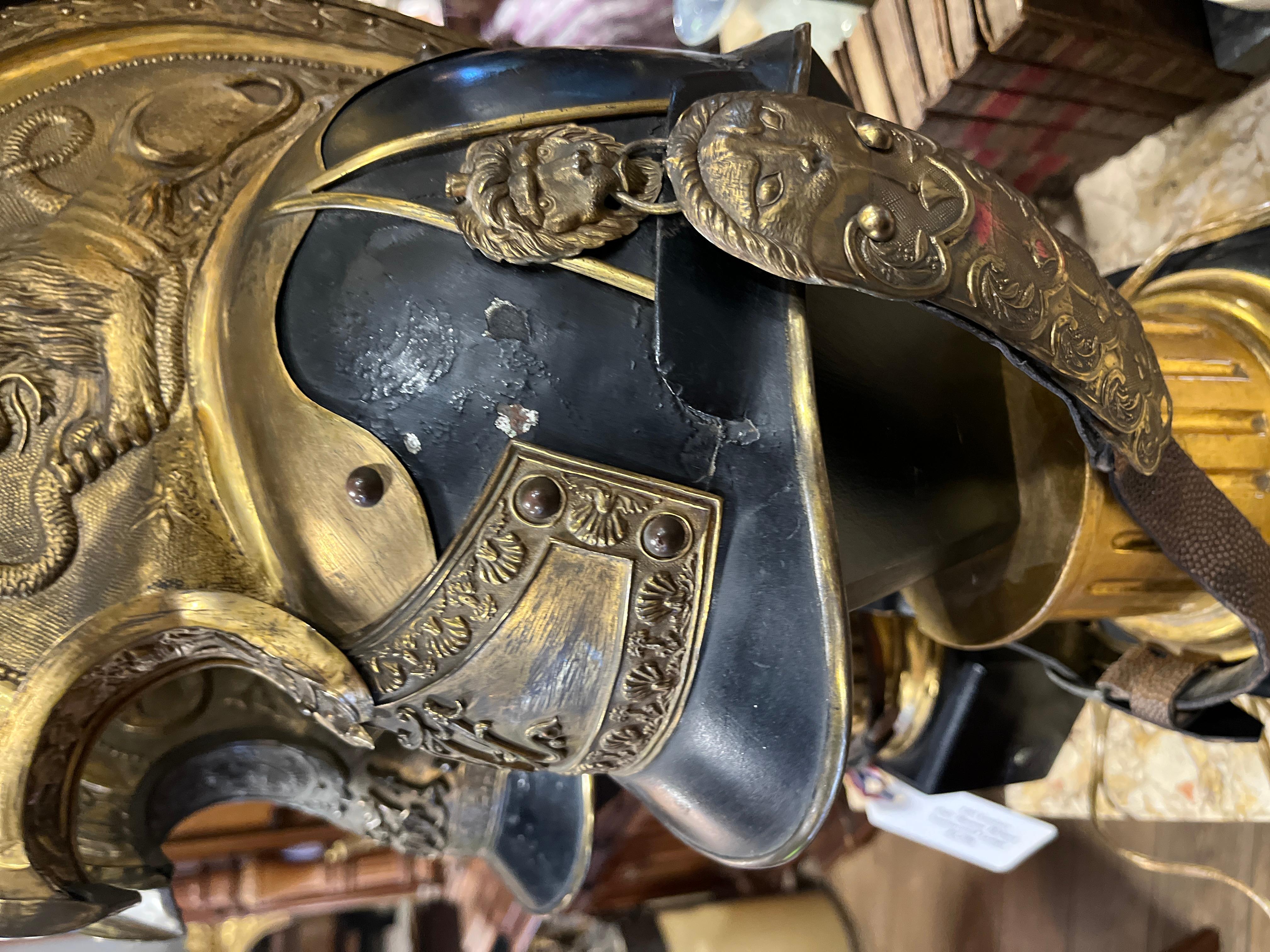 Pair of Antique French Military Helmets Converted to Lamps. Beautiful patina on the helmet with the original leather chin straps.