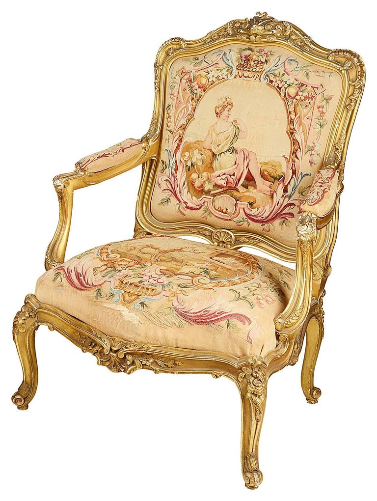 A very impressive good quality pair of French Louis XVI style carved giltwood salon armchairs. Each with scrolling foliate decoration to the show wood, beautiful Aubusson tapestry cover to the back and seats, raised on carved gilded cabriole legs.